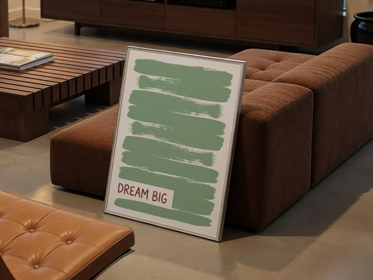Motivational poster with dark Dream Big text over layered sage green brushstroke background.