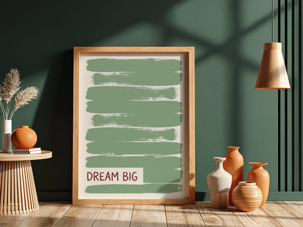 Motivational poster with dark Dream Big text over layered sage green brushstroke background.