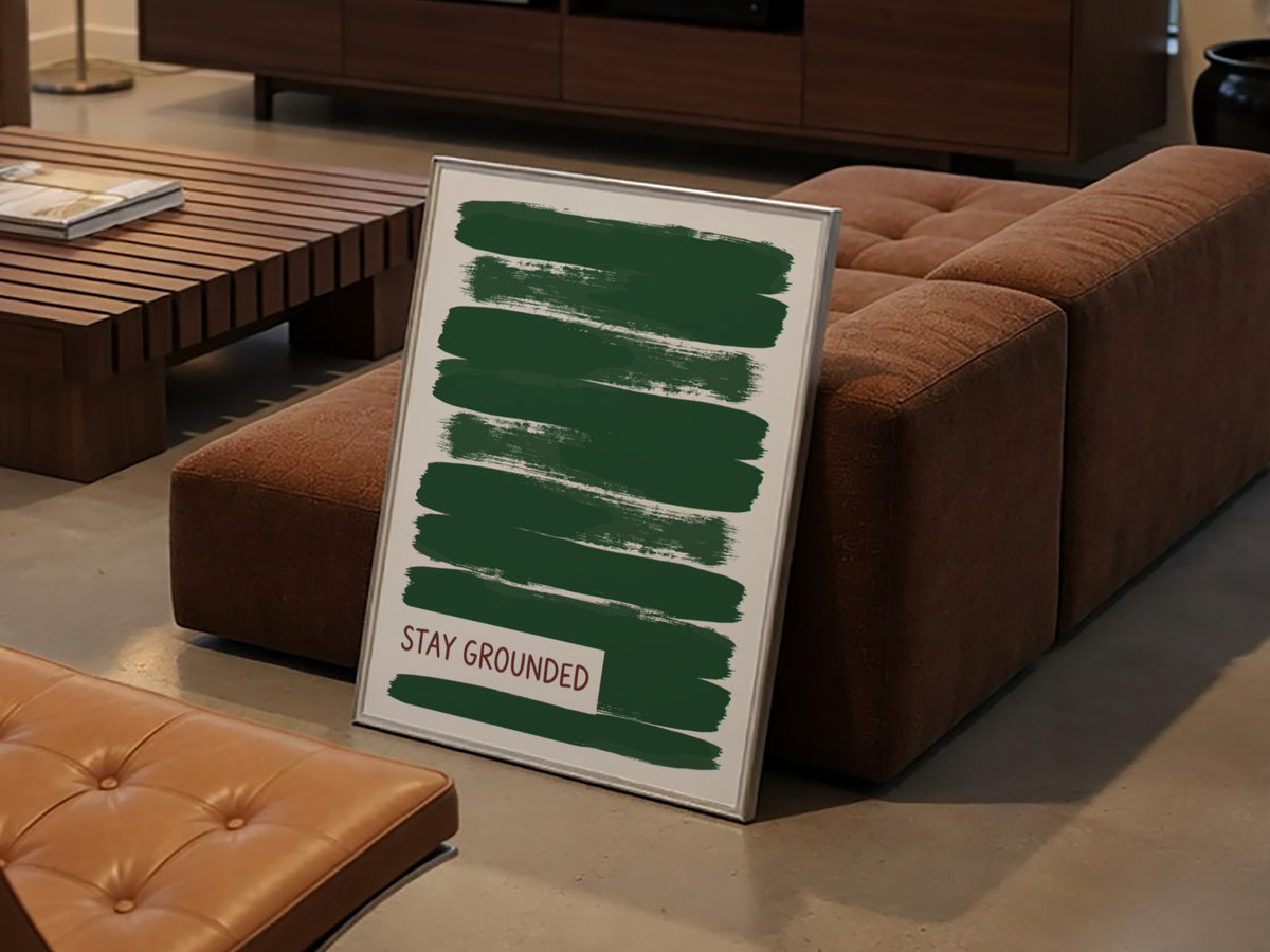 Motivational poster featuring deep forest green brush strokes with the text Stay Grounded
