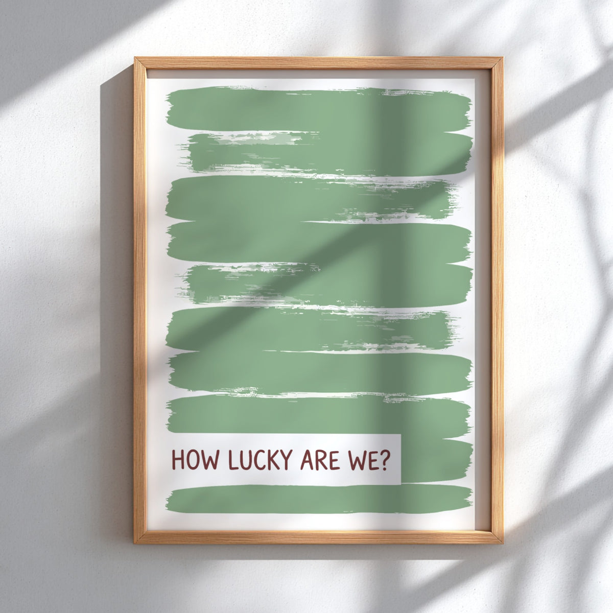 Motivational poster with sage green brushstrokes and the text How Lucky Are We displayed.