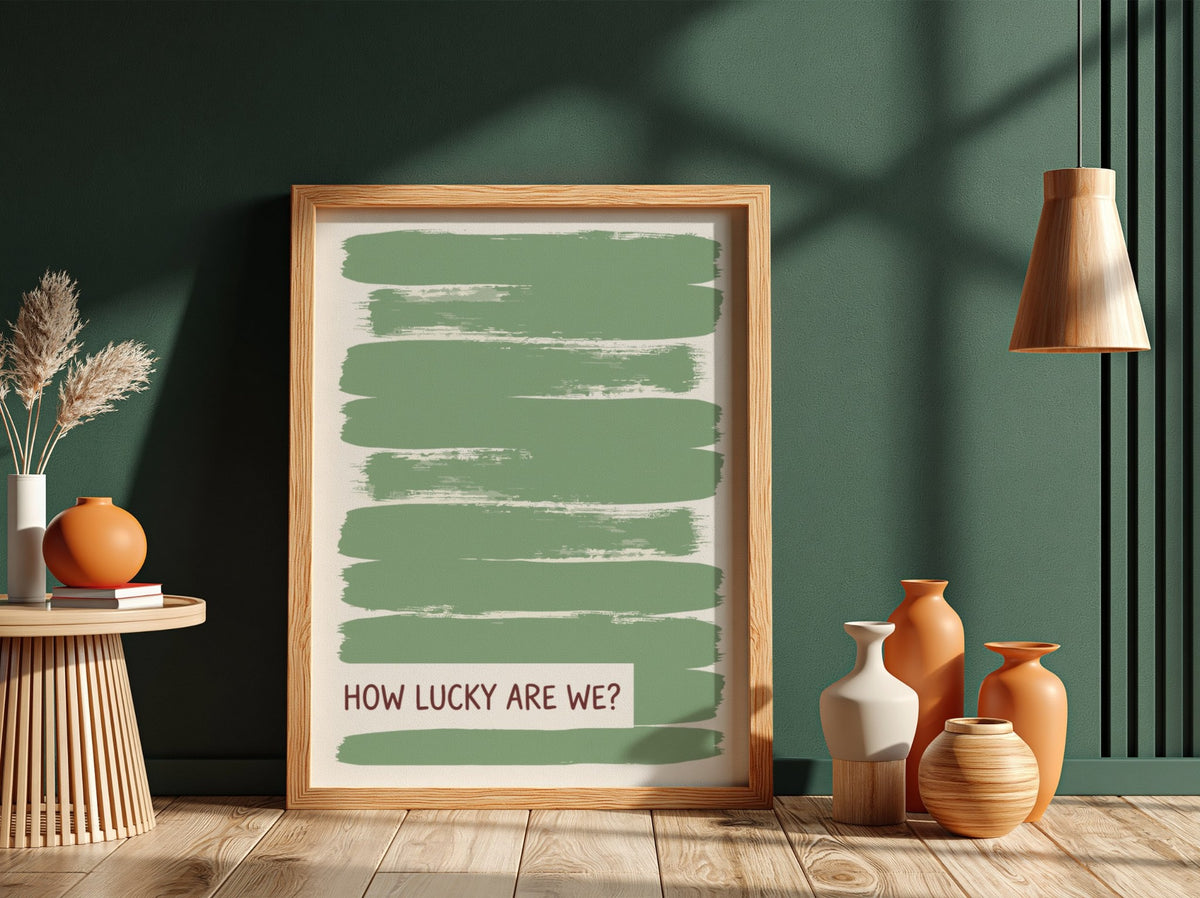 Motivational poster with sage green brushstrokes and the text How Lucky Are We displayed.