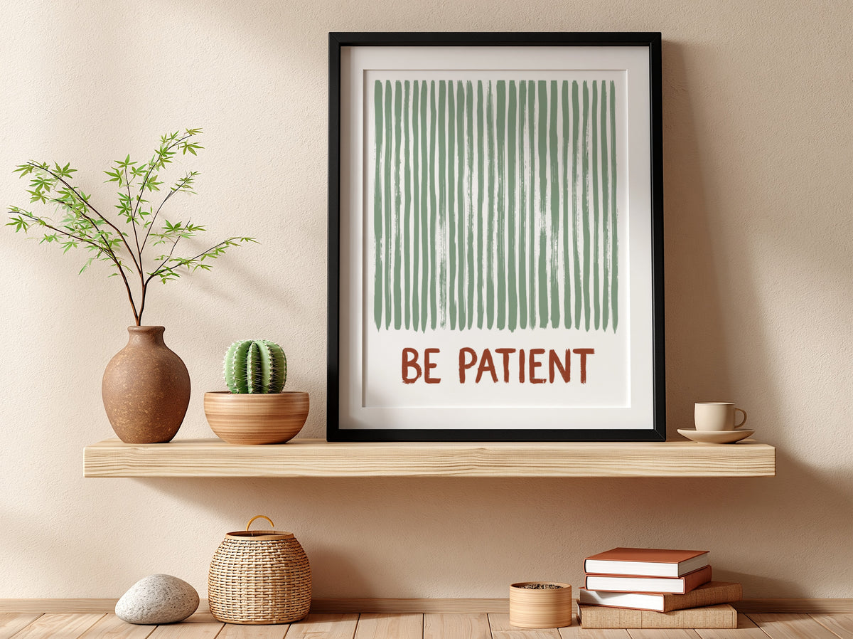 Motivational poster with sage green vertical brushstrokes and the text Be Patient in terracotta.