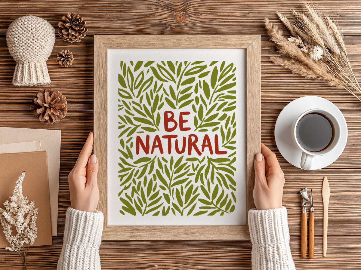 Motivational poster with Be Natural text surrounded by hand-drawn olive green leaf illustrations.