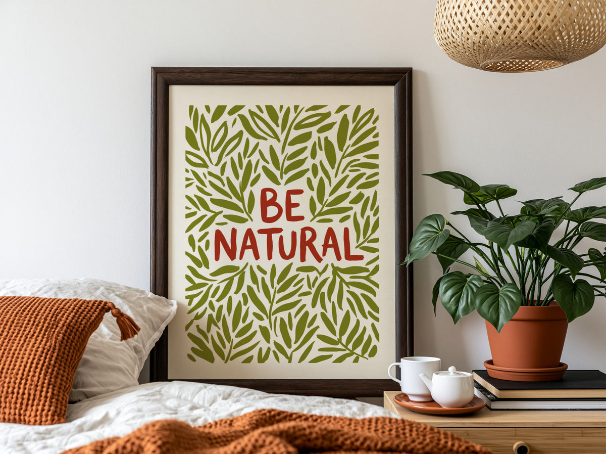 Motivational poster with Be Natural text surrounded by hand-drawn olive green leaf illustrations.