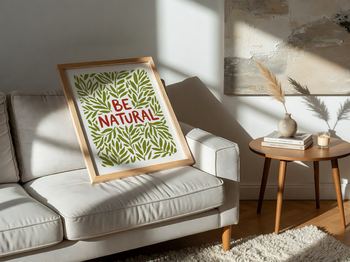 Motivational poster with Be Natural text surrounded by hand-drawn olive green leaf illustrations.