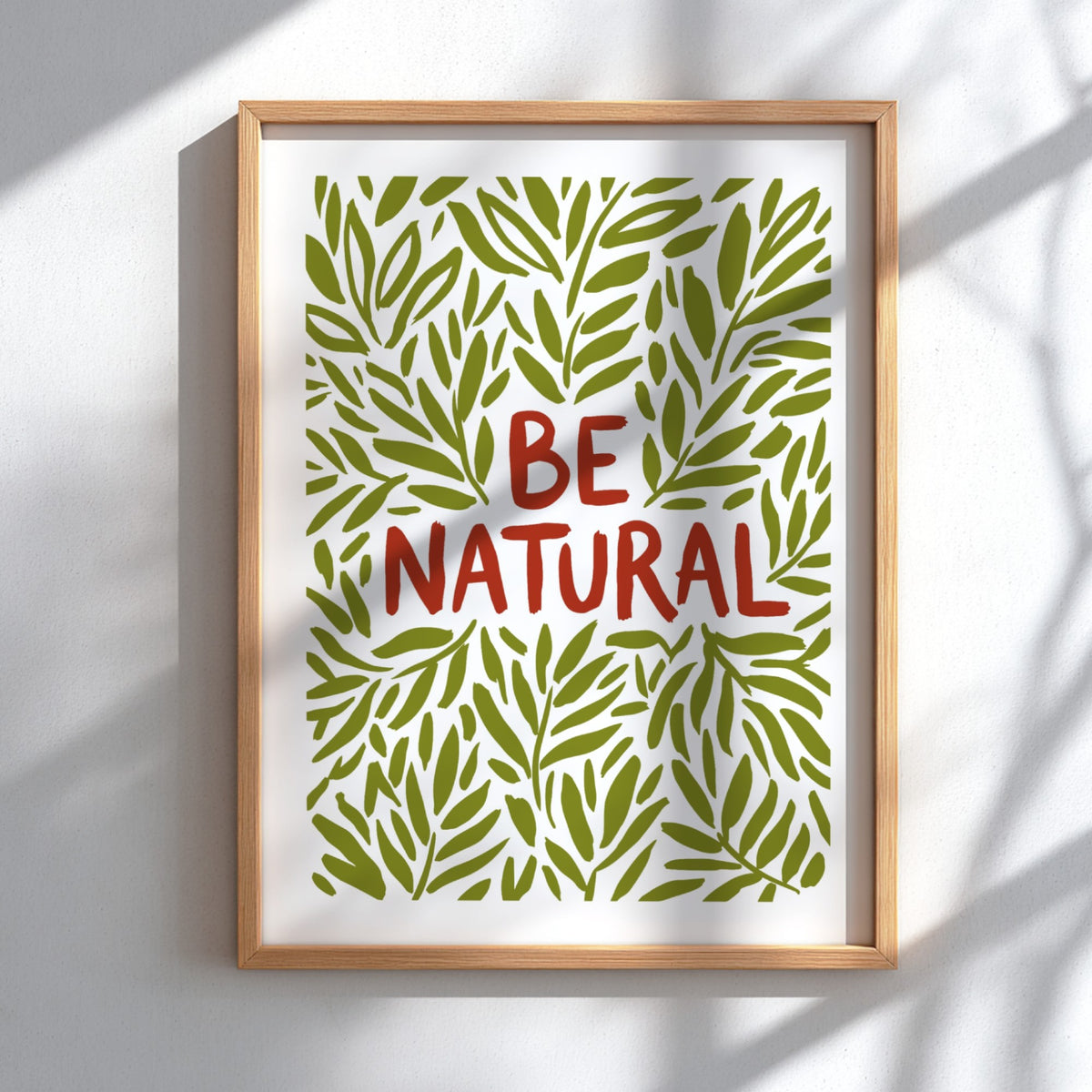 Motivational poster with Be Natural text surrounded by hand-drawn olive green leaf illustrations.