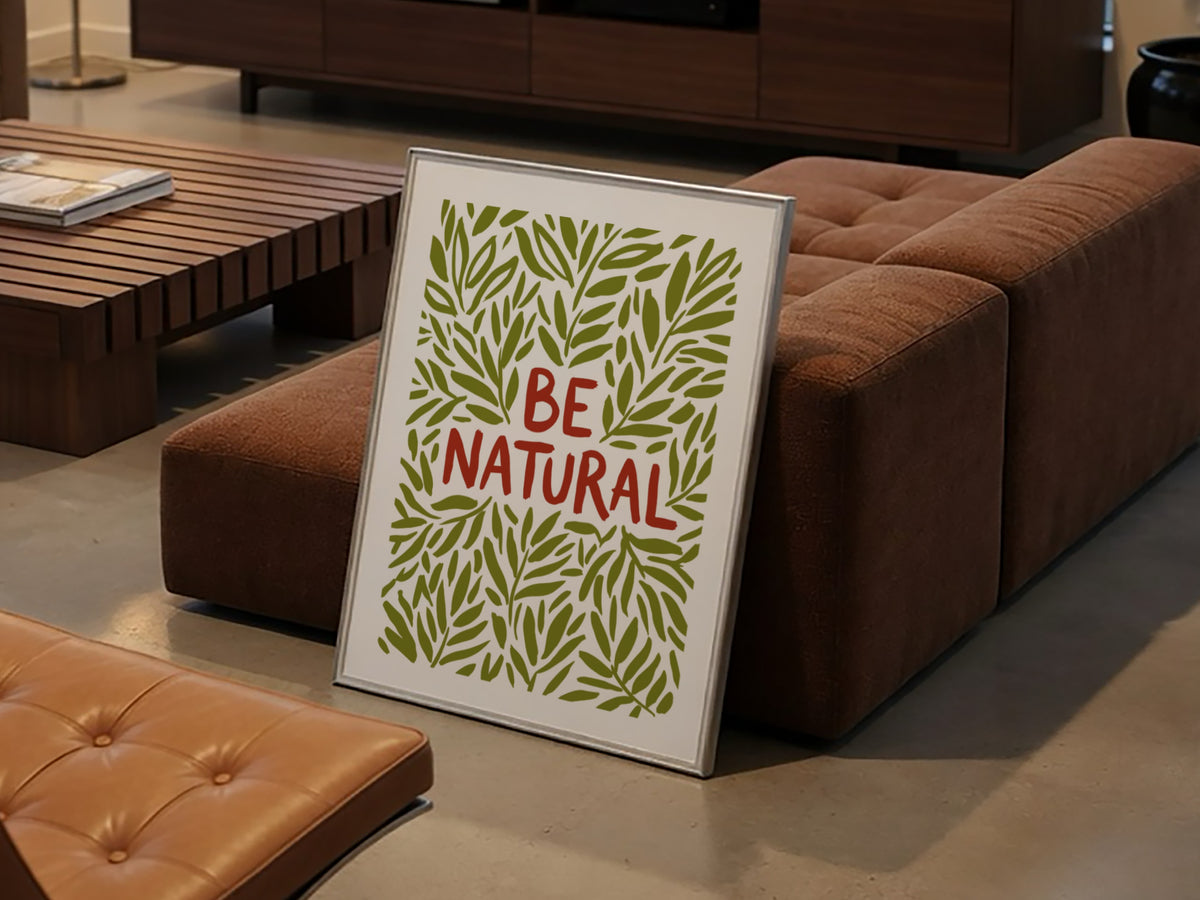 Motivational poster with Be Natural text surrounded by hand-drawn olive green leaf illustrations.