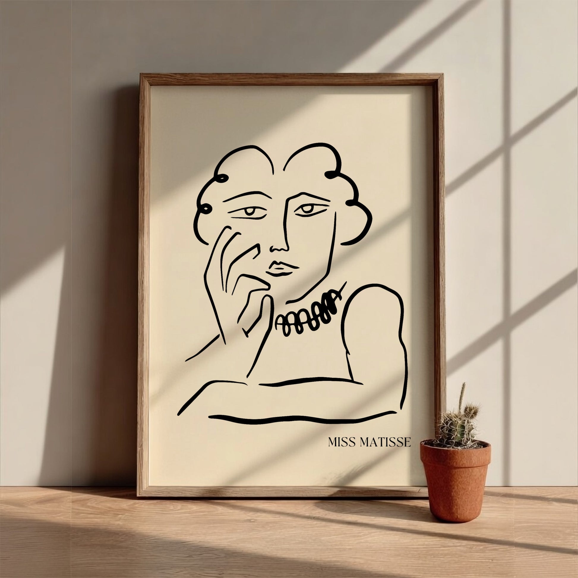Miss Matisse line art poster featuring a portrait with a beaded necklace on a cream background.