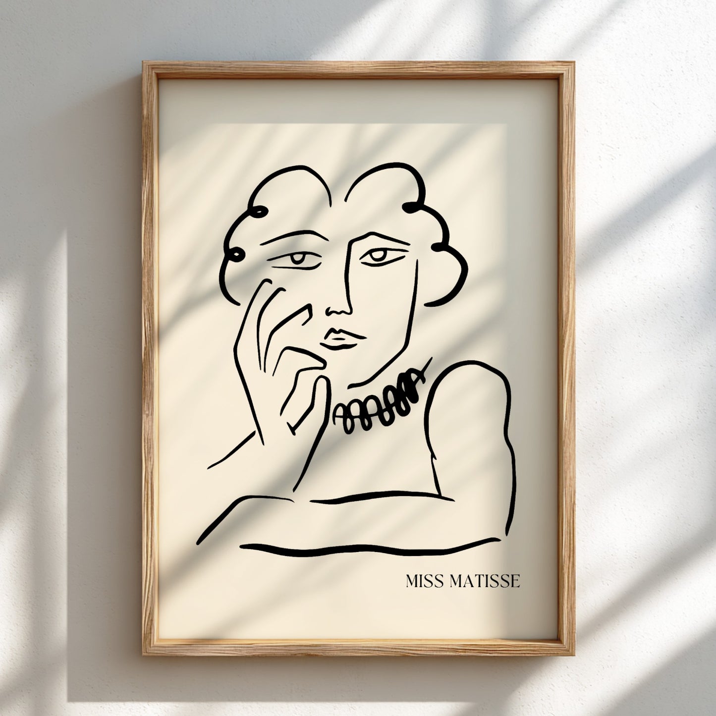 Miss Matisse line art poster featuring a portrait with a beaded necklace on a cream background.