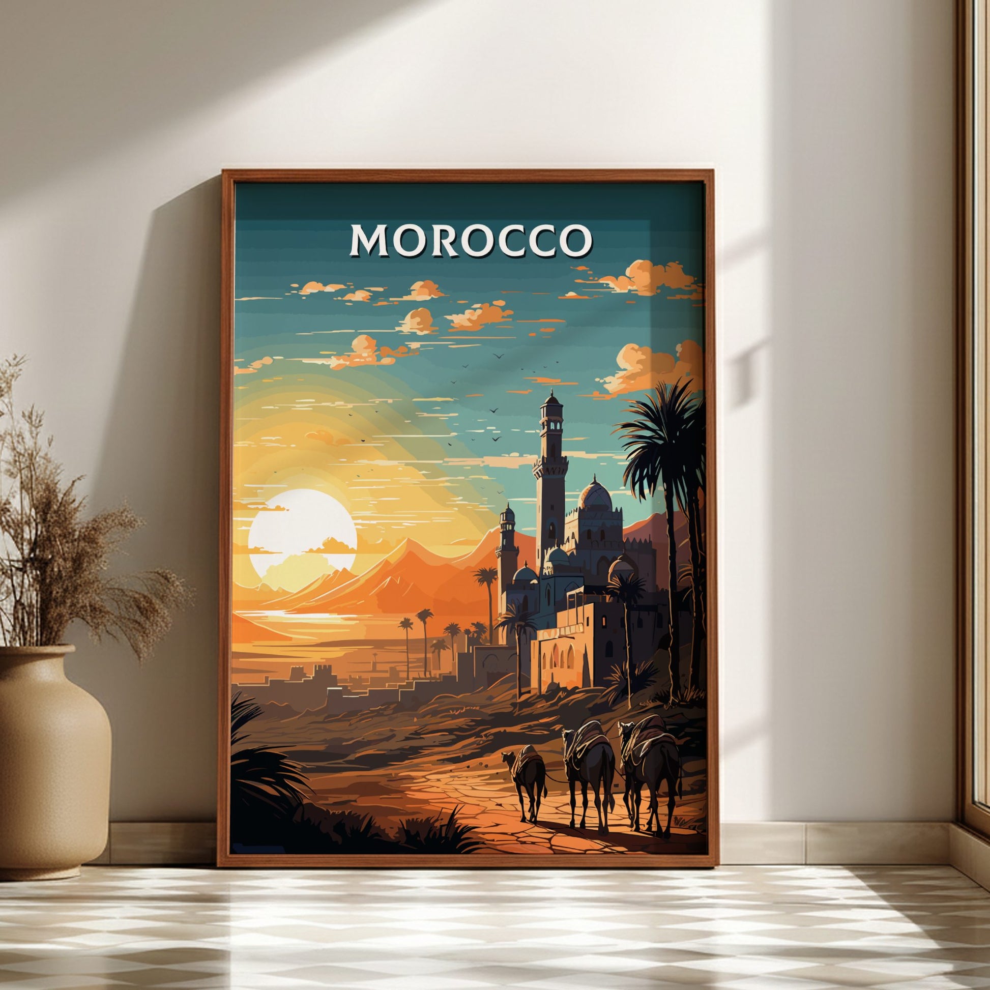 Framed artwork of a Moroccan landscape with a sunset, palm trees, and buildings.