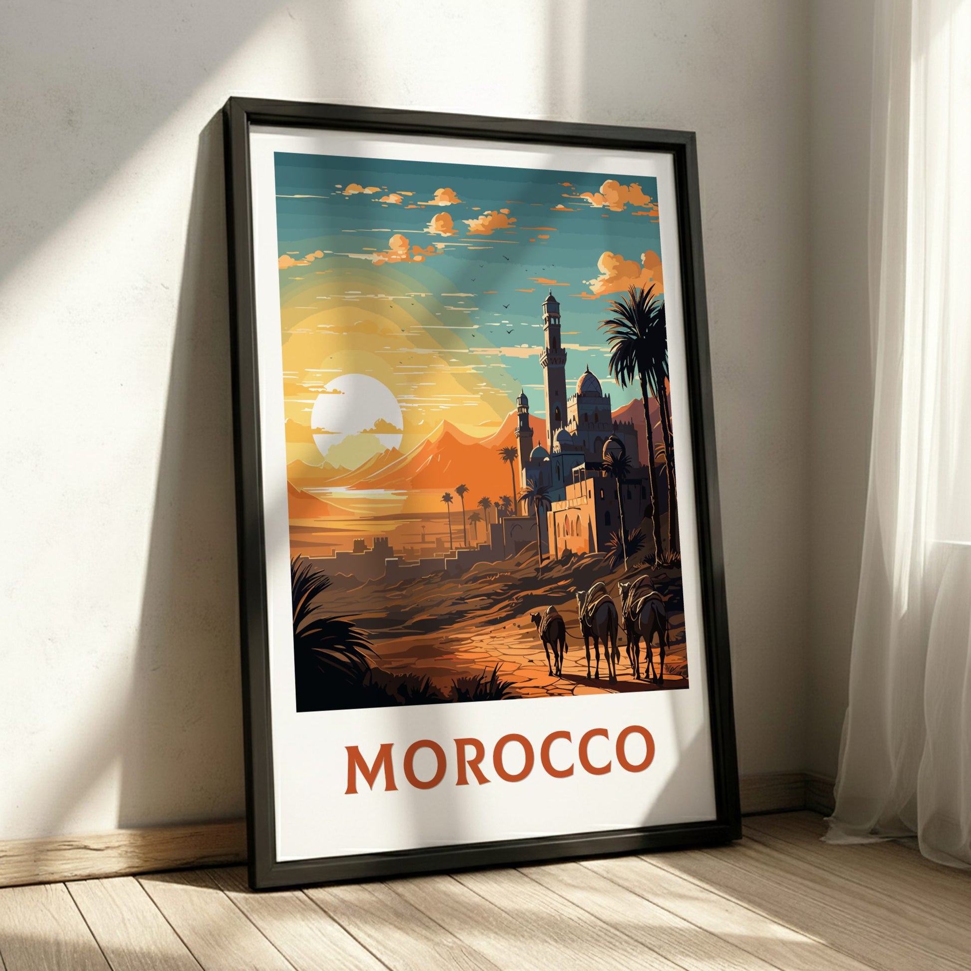 Framed artwork of a Moroccan landscape with a sunset, palm trees, and buildings.
