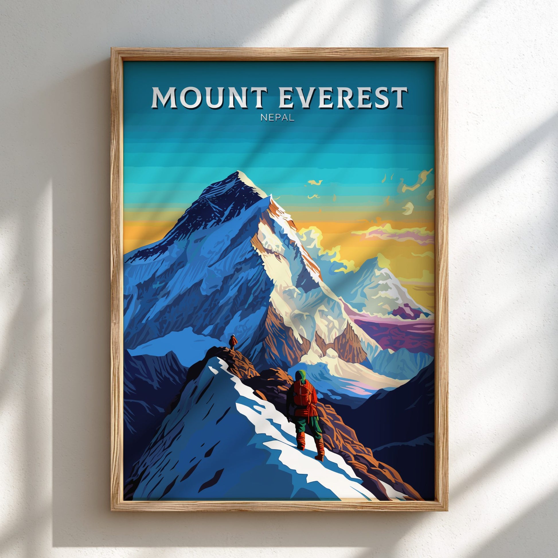 Framed poster of Mount Everest with a climber on the mountain, set against a blue sky.