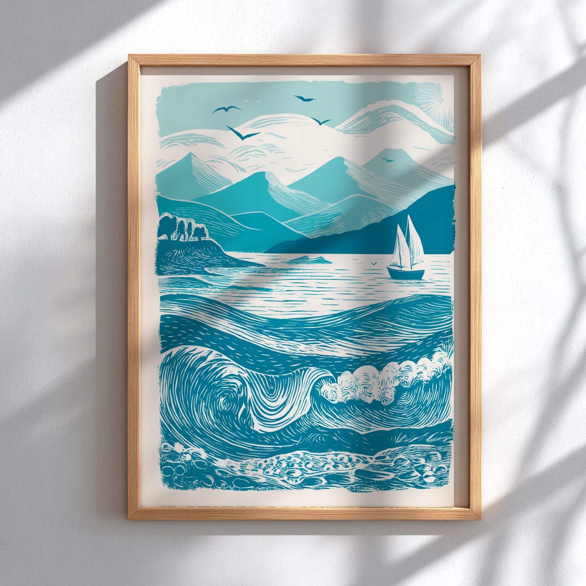 Framed artwork of a mountain and wave landscape on a white wall.
