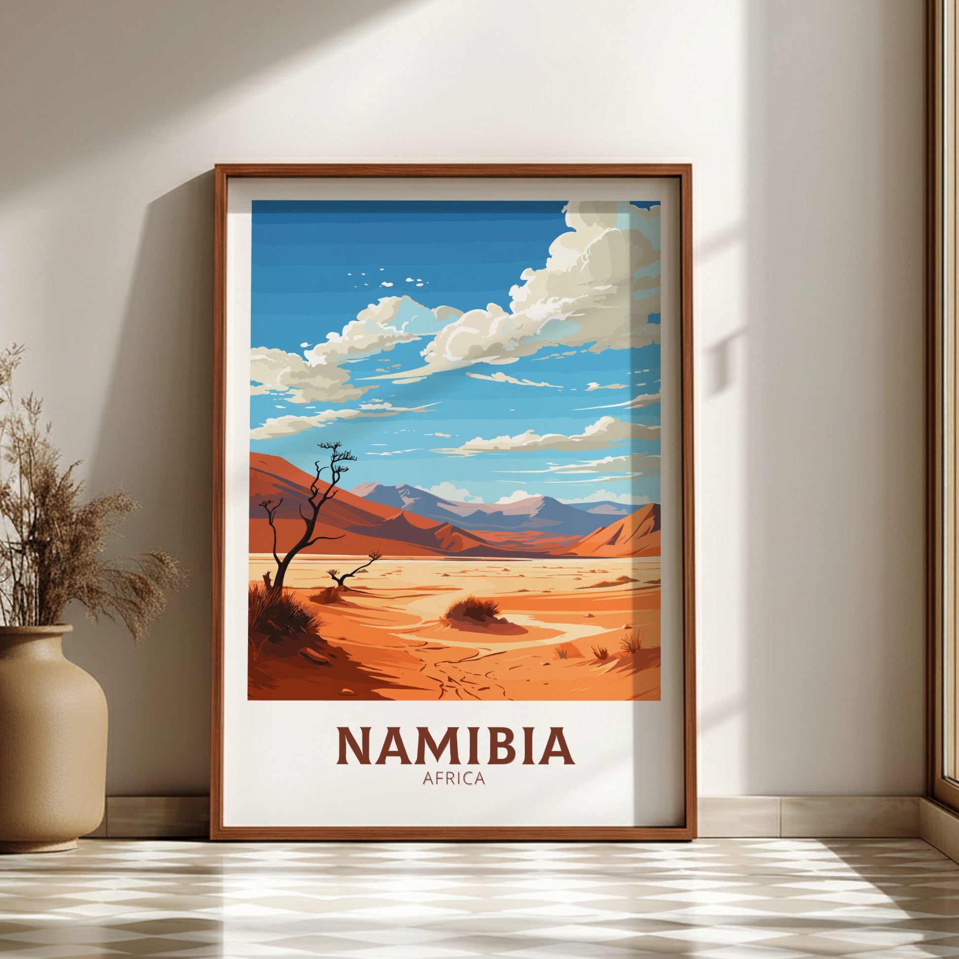 Framed artwork of a desert landscape with 'Namibia, Africa' text on a wall.