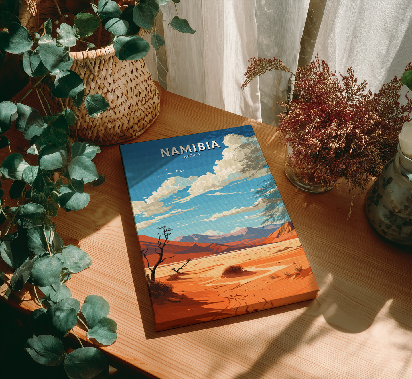 Book titled 'Namibia' on a wooden table with plants around