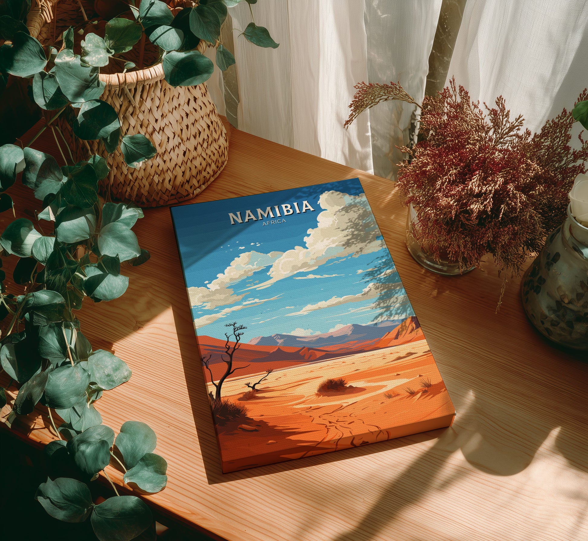Book titled 'Namibia' on a wooden table with plants around
