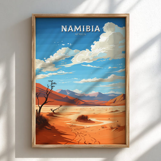 Framed artwork of a desert landscape with 'Namibia' text on a white wall.