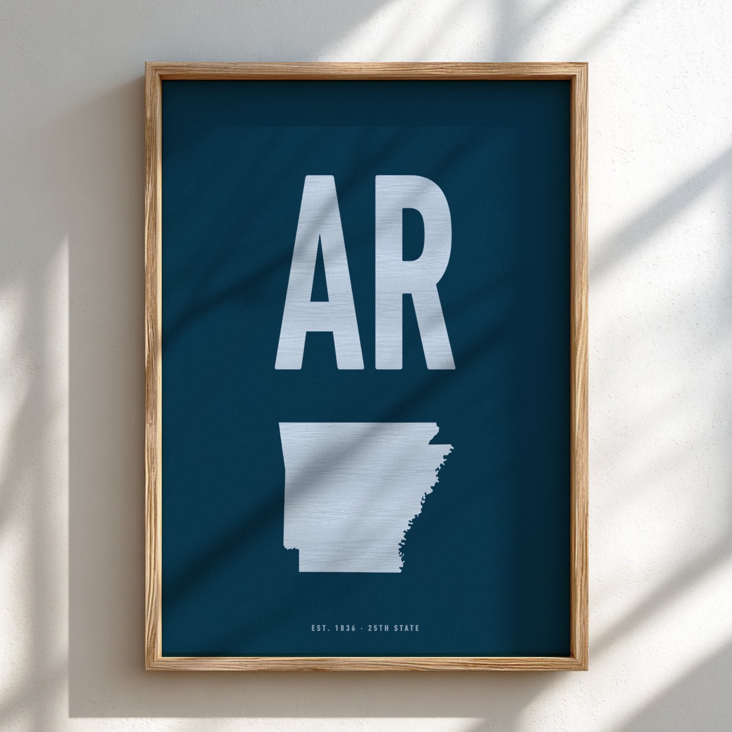 Framed poster with 'AR' and outline of Arkansas on a blue background