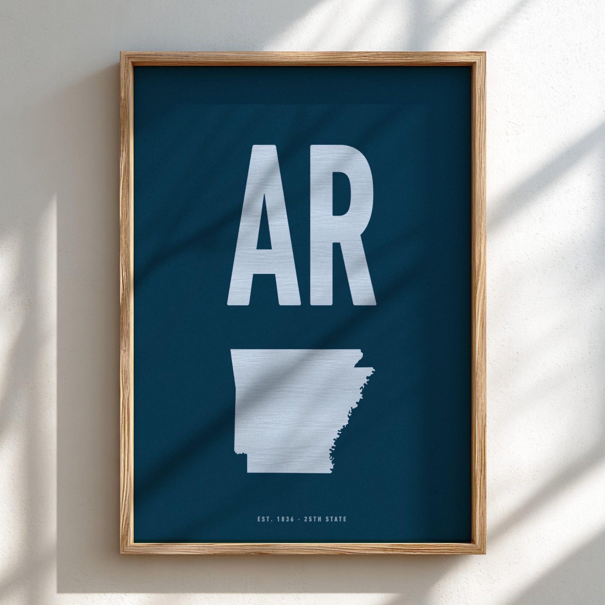 Framed poster with 'AR' and outline of Arkansas on a blue background