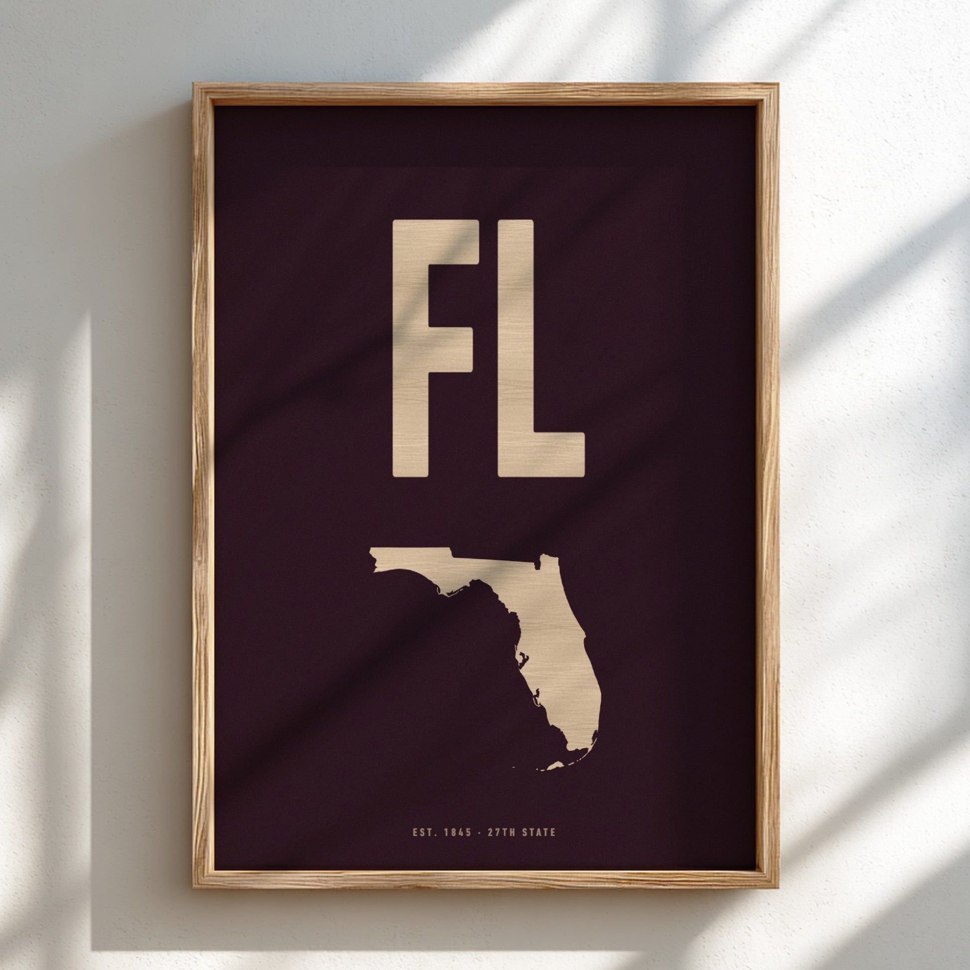 Framed artwork with 'FL' and outline of Florida on a dark background