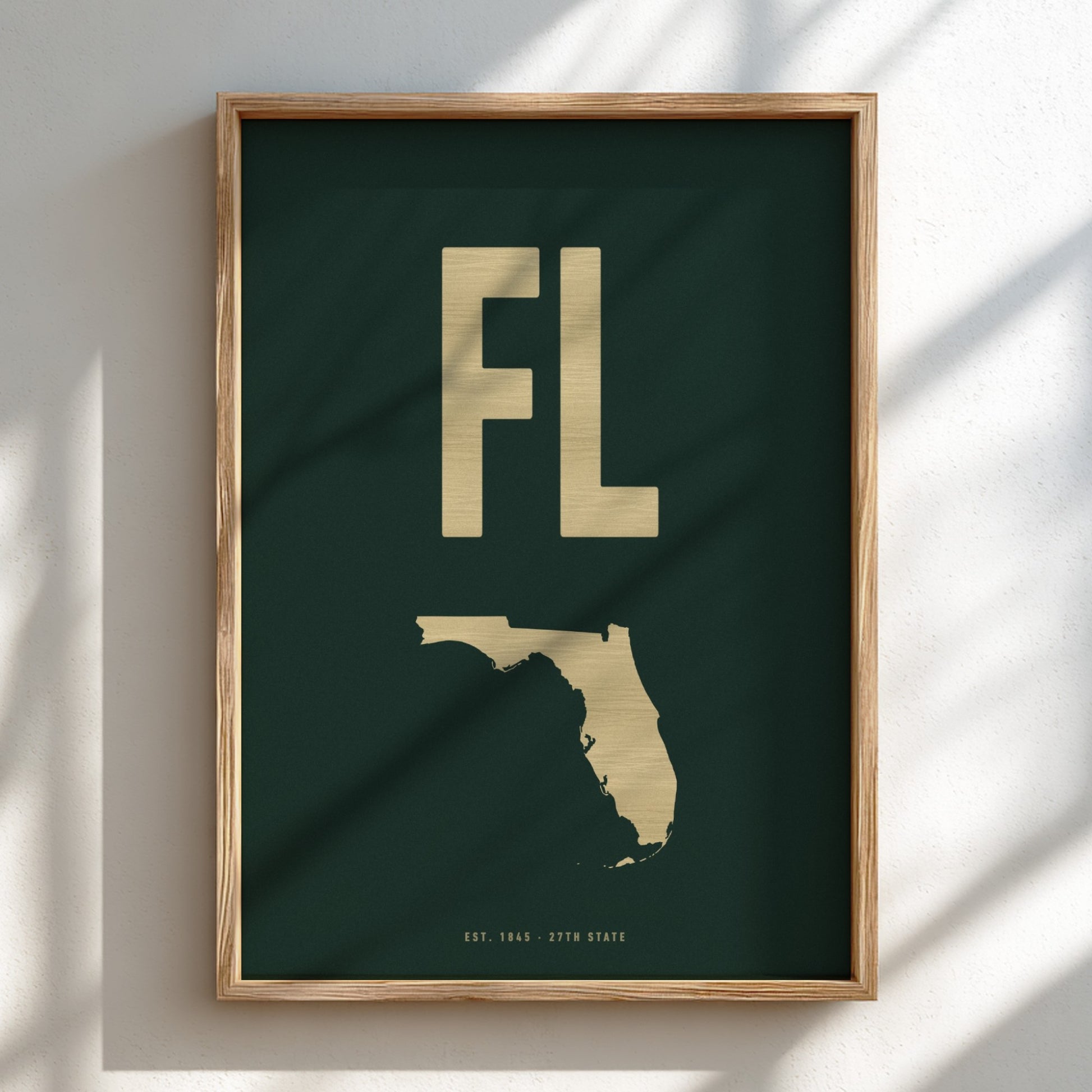 Framed artwork with 'FL' and outline of Florida on a dark green background
