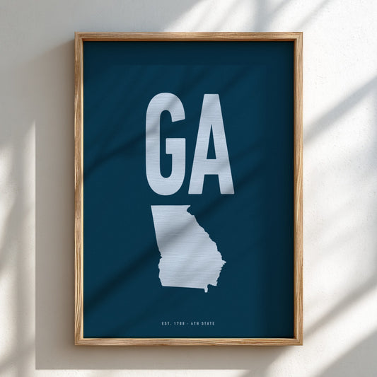 Framed poster with a map of Georgia and 'GA' on a blue background