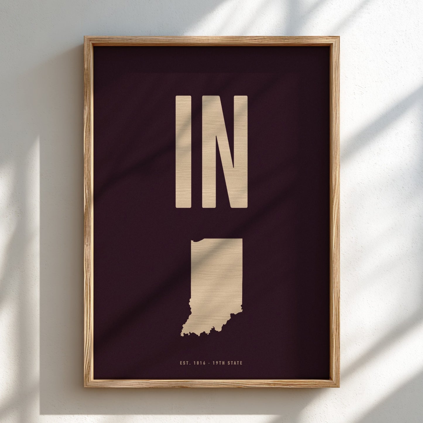 Framed poster of Indiana with 'IN' on a dark background