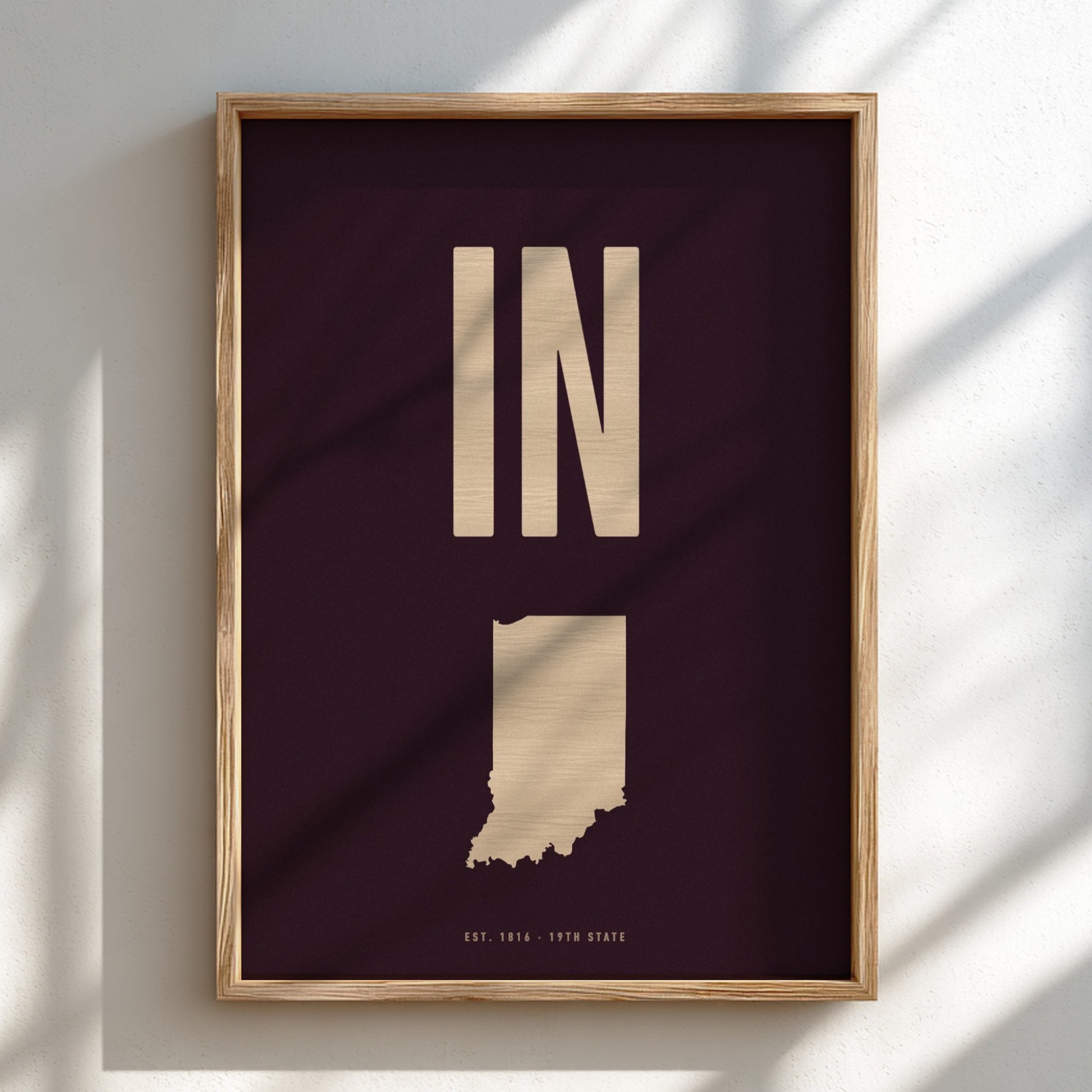 Framed poster of Indiana with 'IN' on a dark background