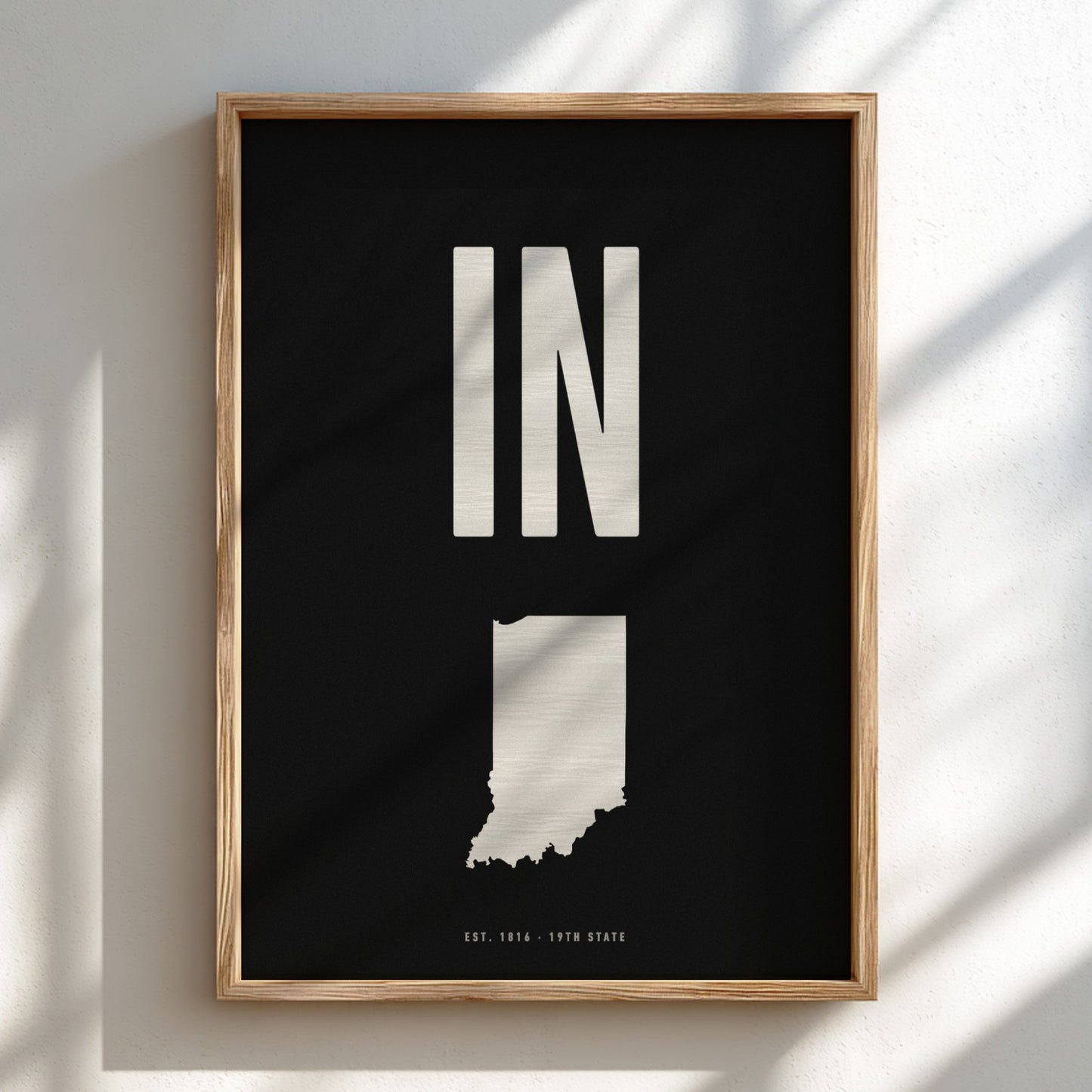 Framed poster of Indiana with 'IN' on a black background