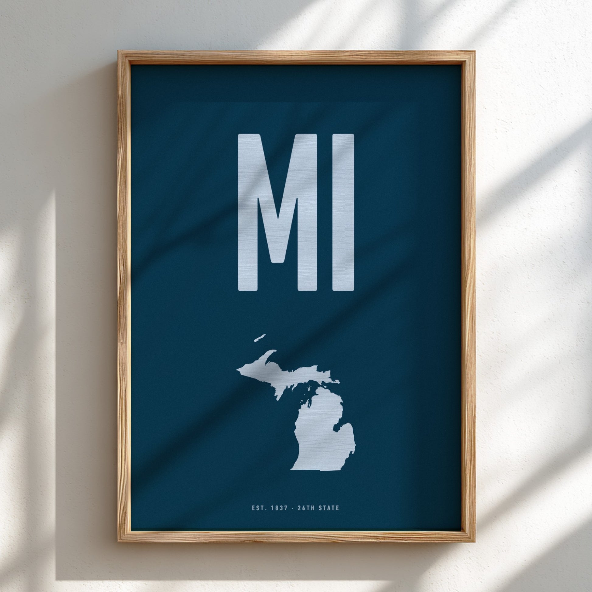 Framed poster with 'MI' and a map of Michigan on a blue background