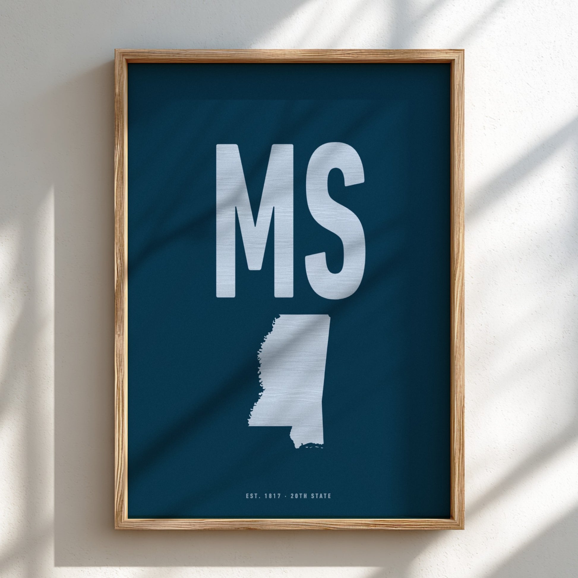 Framed poster with 'MS' and a map of Mississippi on a blue background
