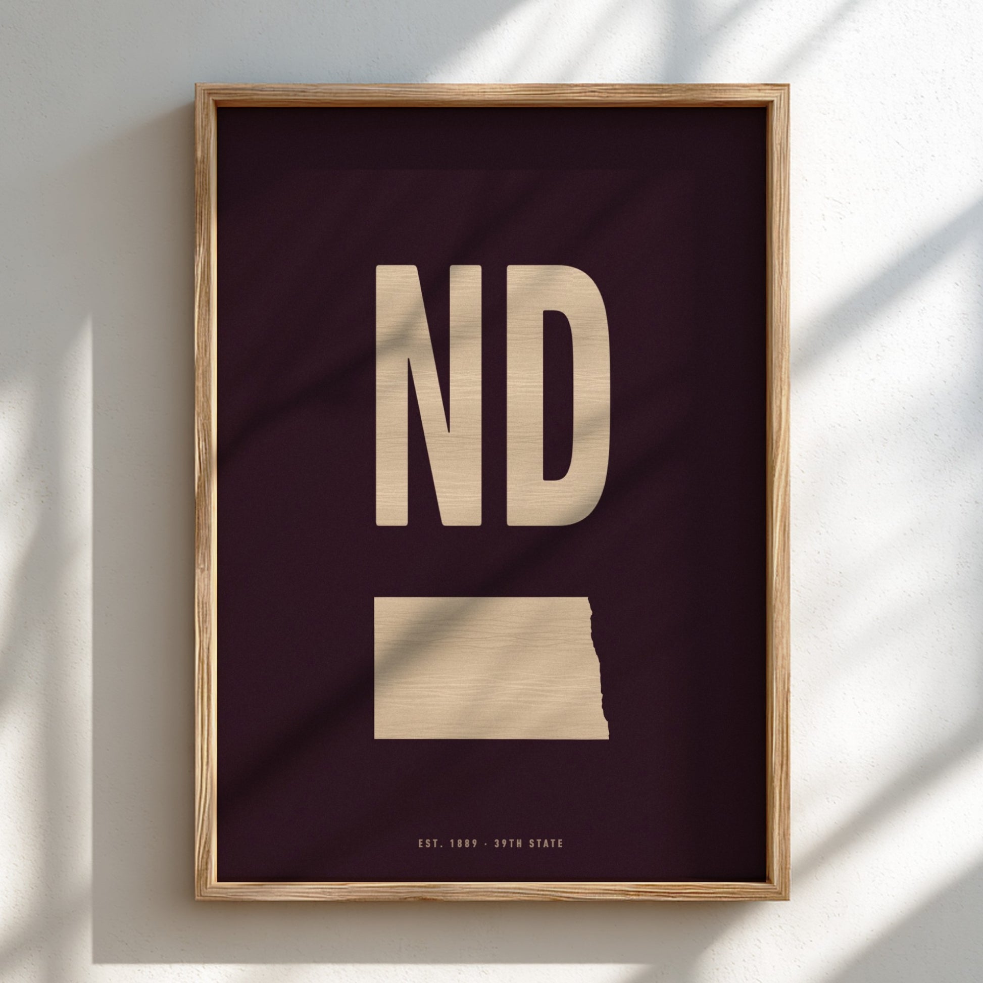 Framed artwork with 'ND' in gold on a dark background