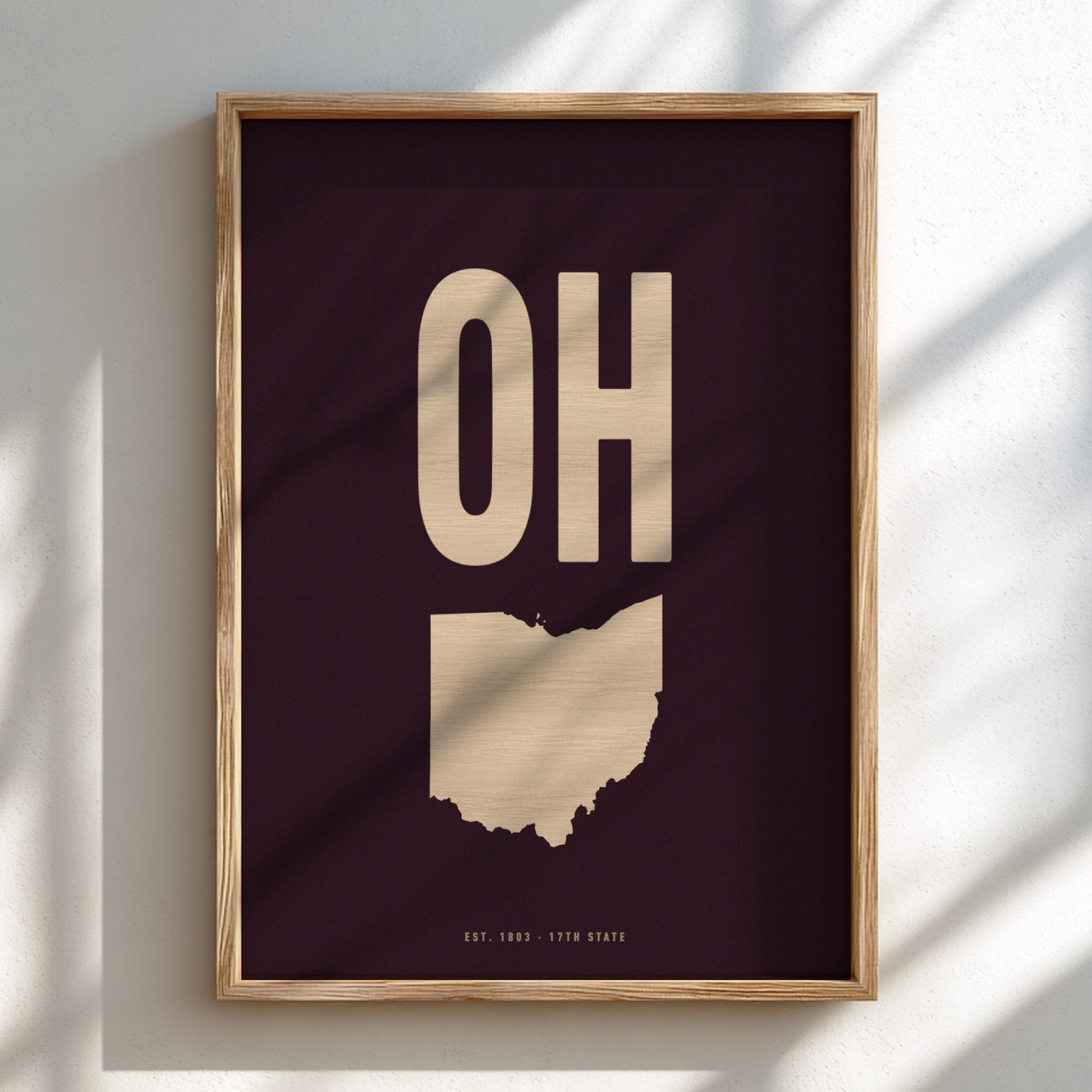 Framed artwork with 'OH' on a dark background
