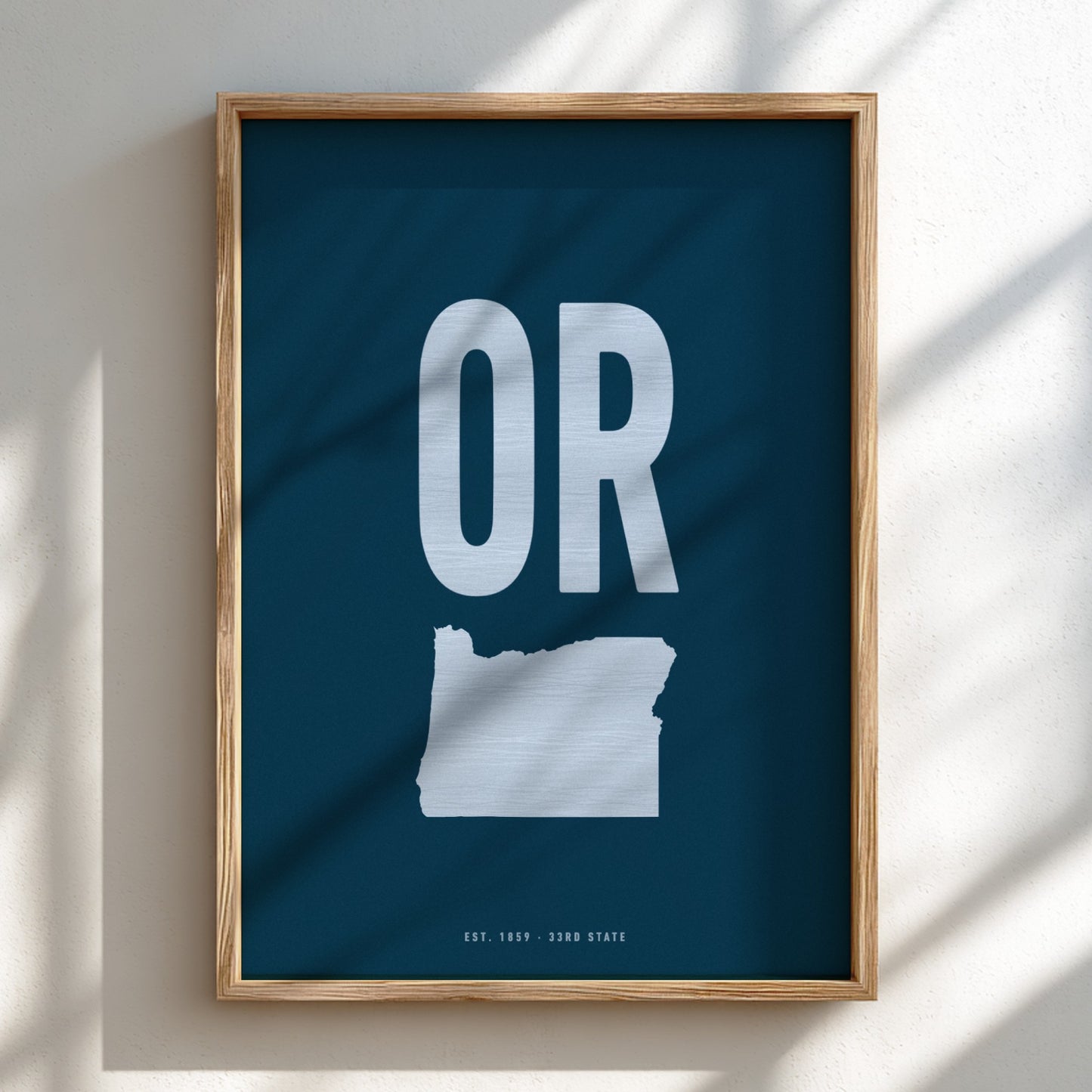 Framed poster with 'OR' and outline of Oregon on a blue background