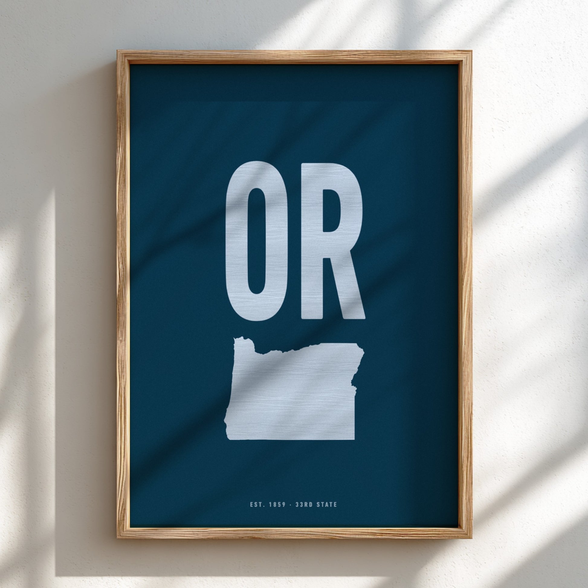 Framed poster with 'OR' and outline of Oregon on a blue background