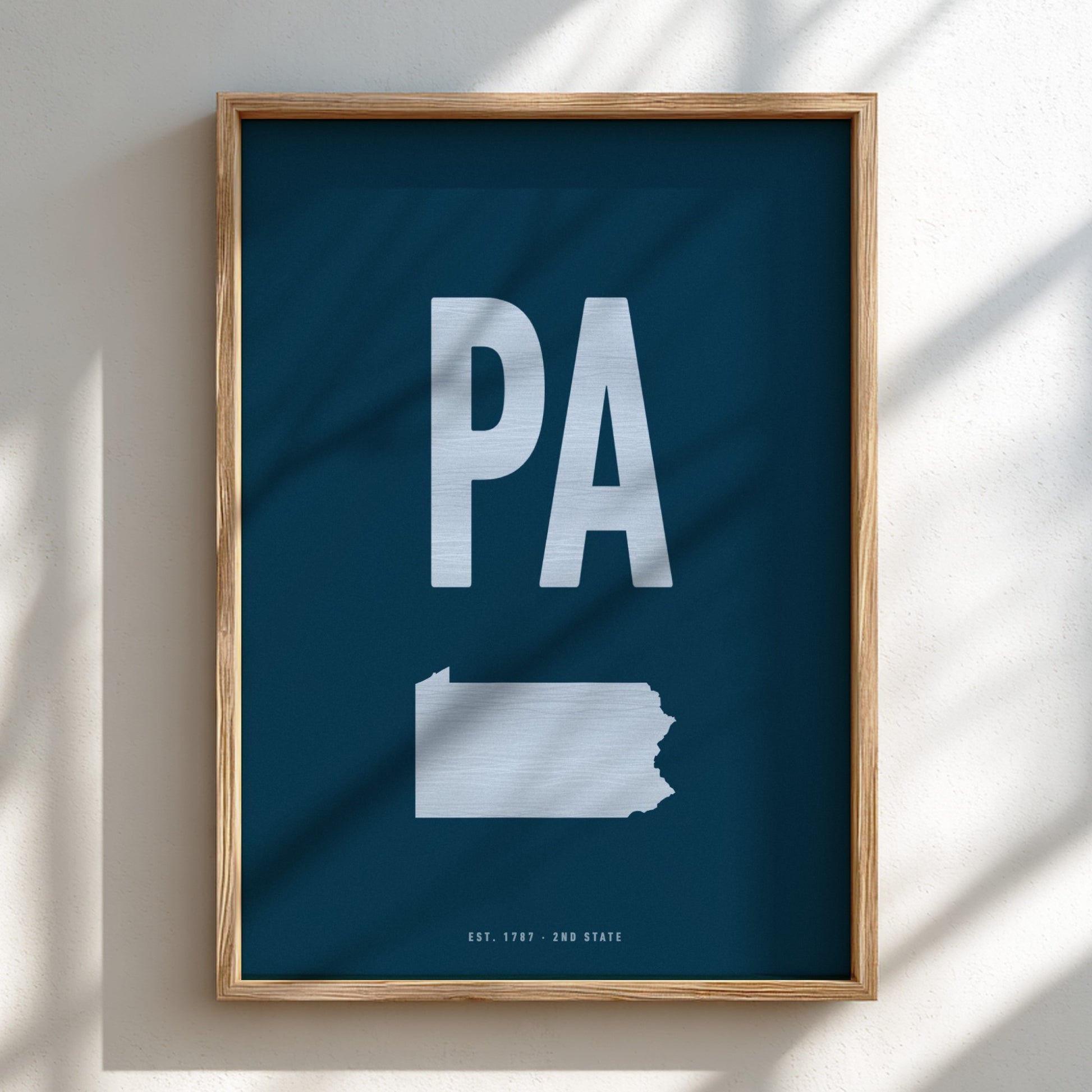 Framed poster with 'PA' and outline of Pennsylvania on a blue background