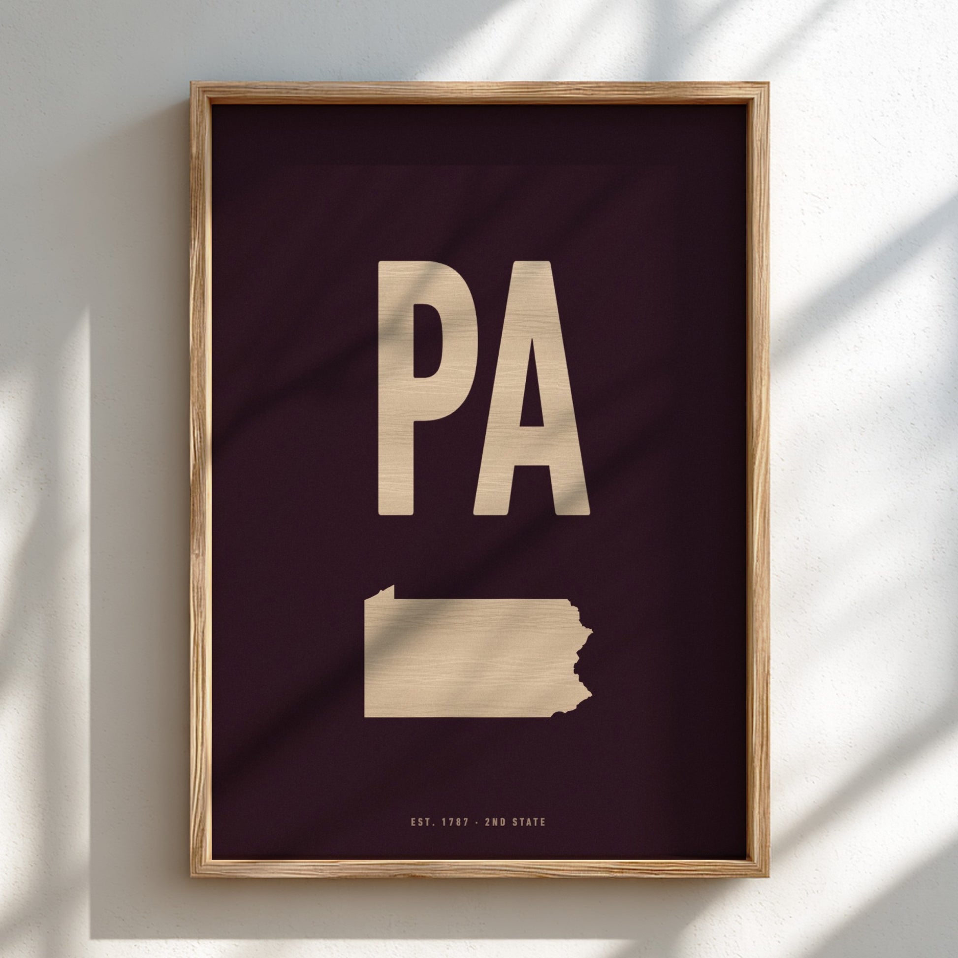 Framed artwork with 'PA' on a dark background