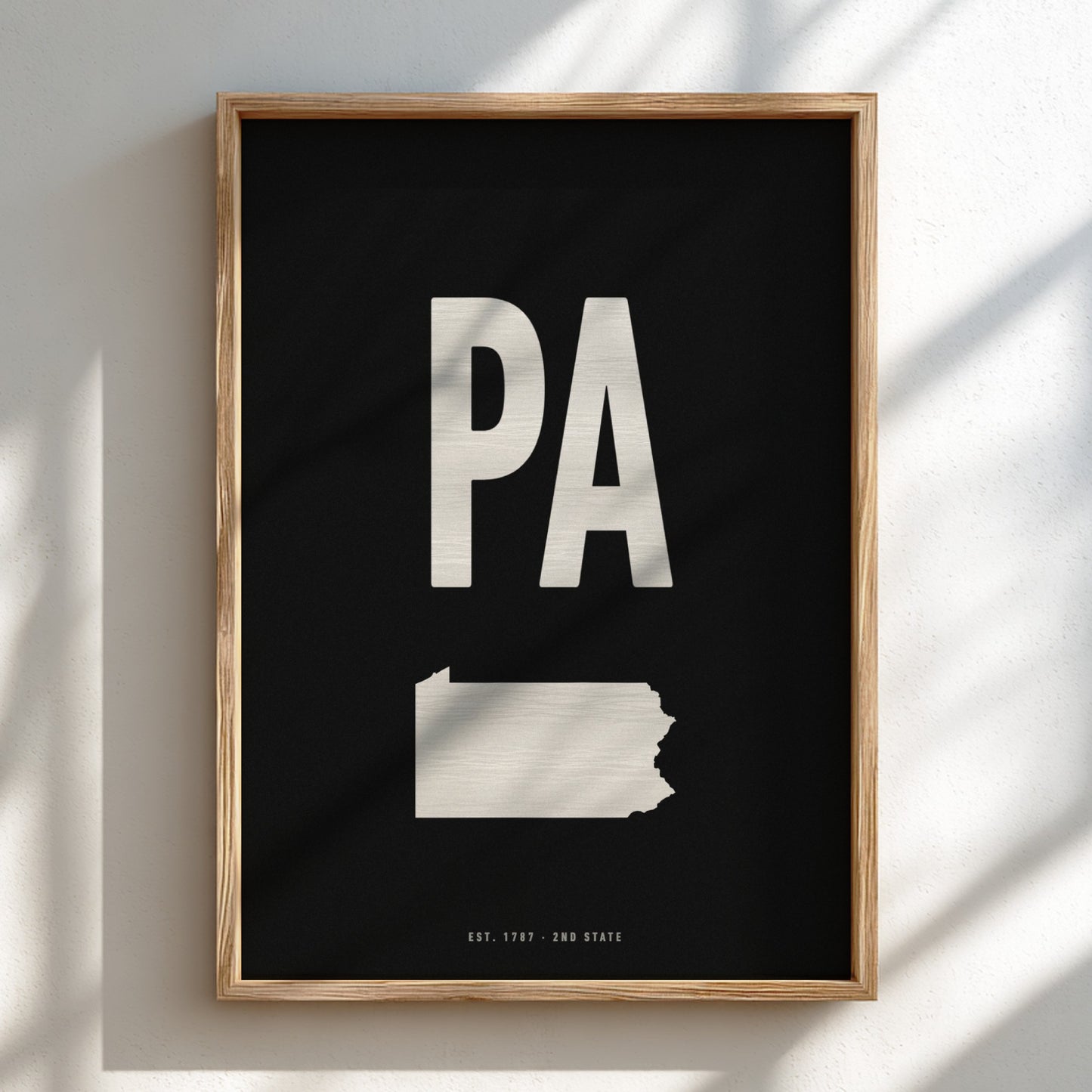 Framed poster with 'PA' and outline of Pennsylvania on a black background