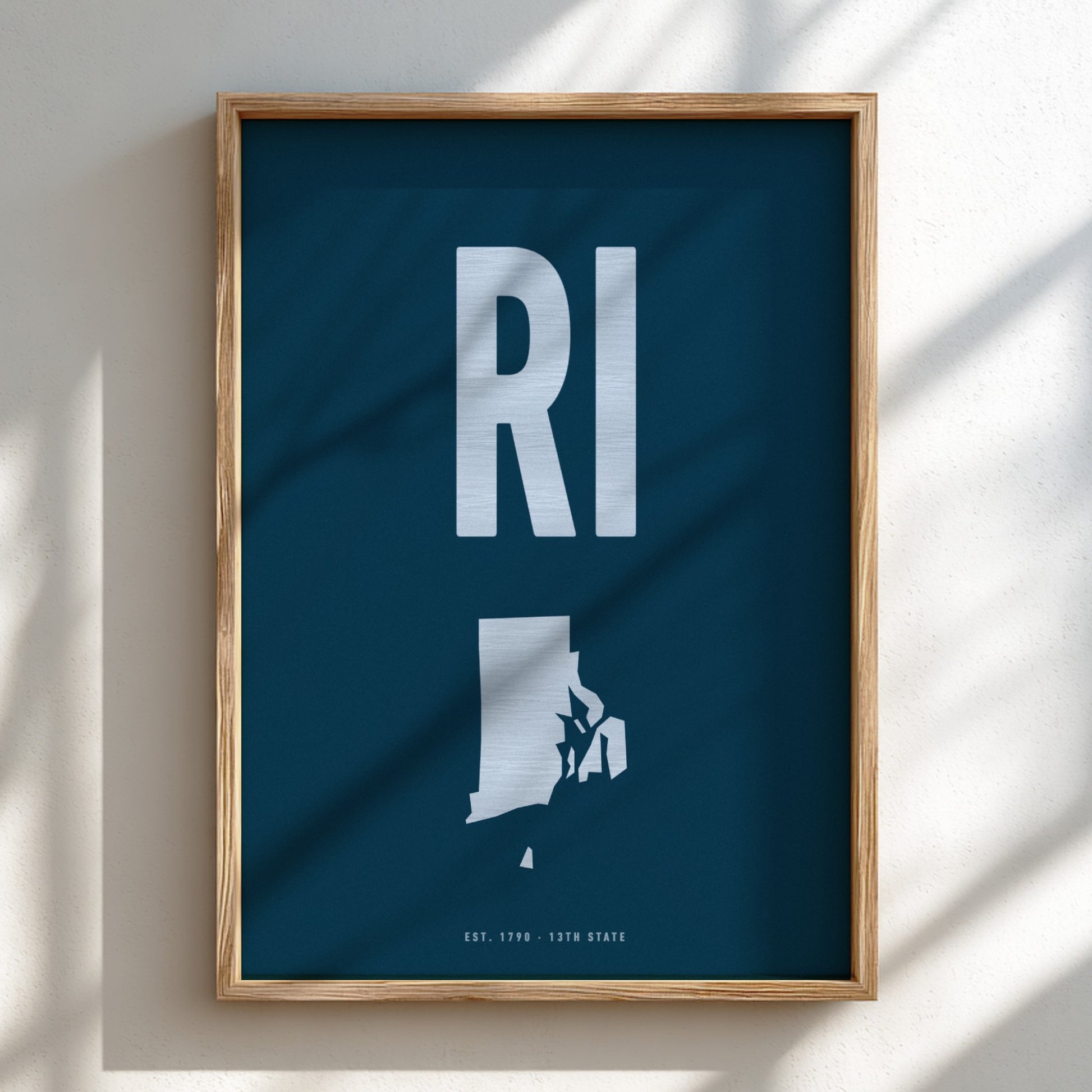 Framed poster with 'RI' and state outline on a blue background