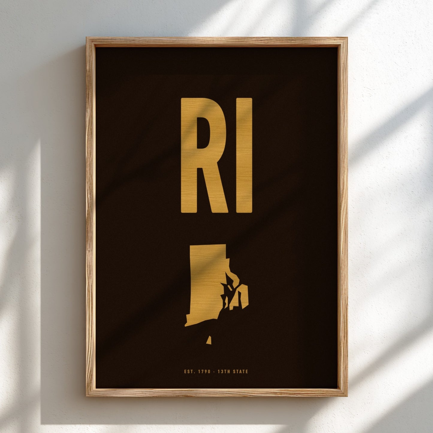 Framed artwork with 'RI' in gold on a dark background