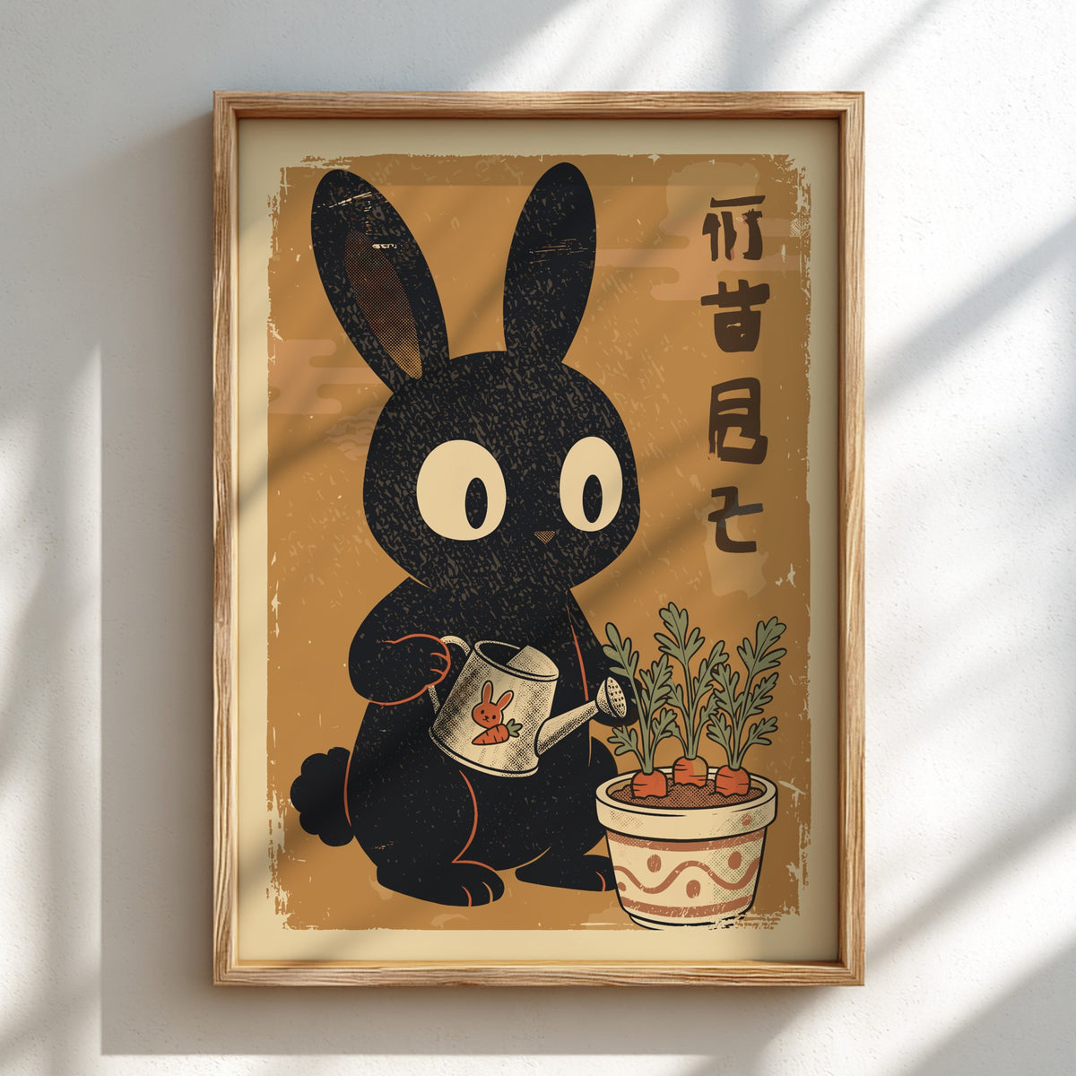 A framed vintage-style art print featuring a black rabbit watering a potted plant, displayed on a light wall with soft diagonal shadows.