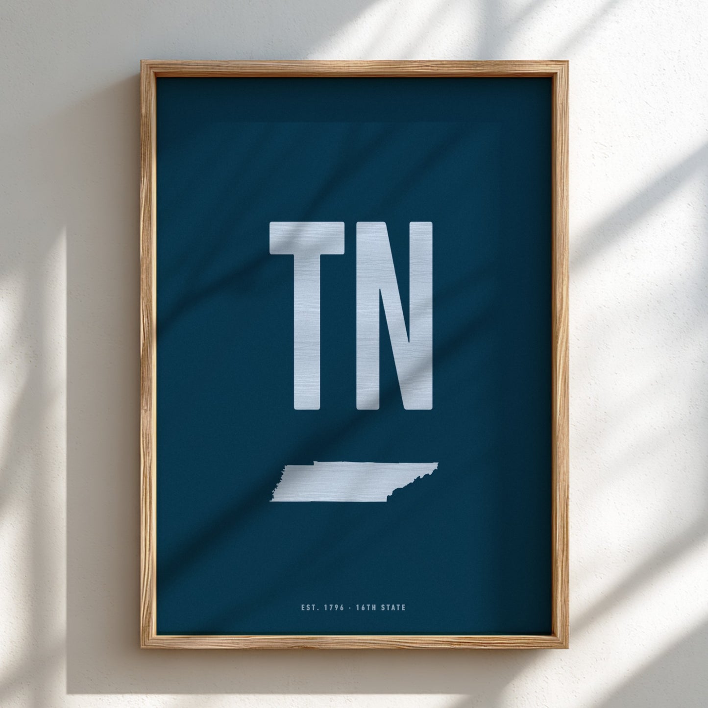 Framed poster with 'TN' and a map of Tennessee on a blue background
