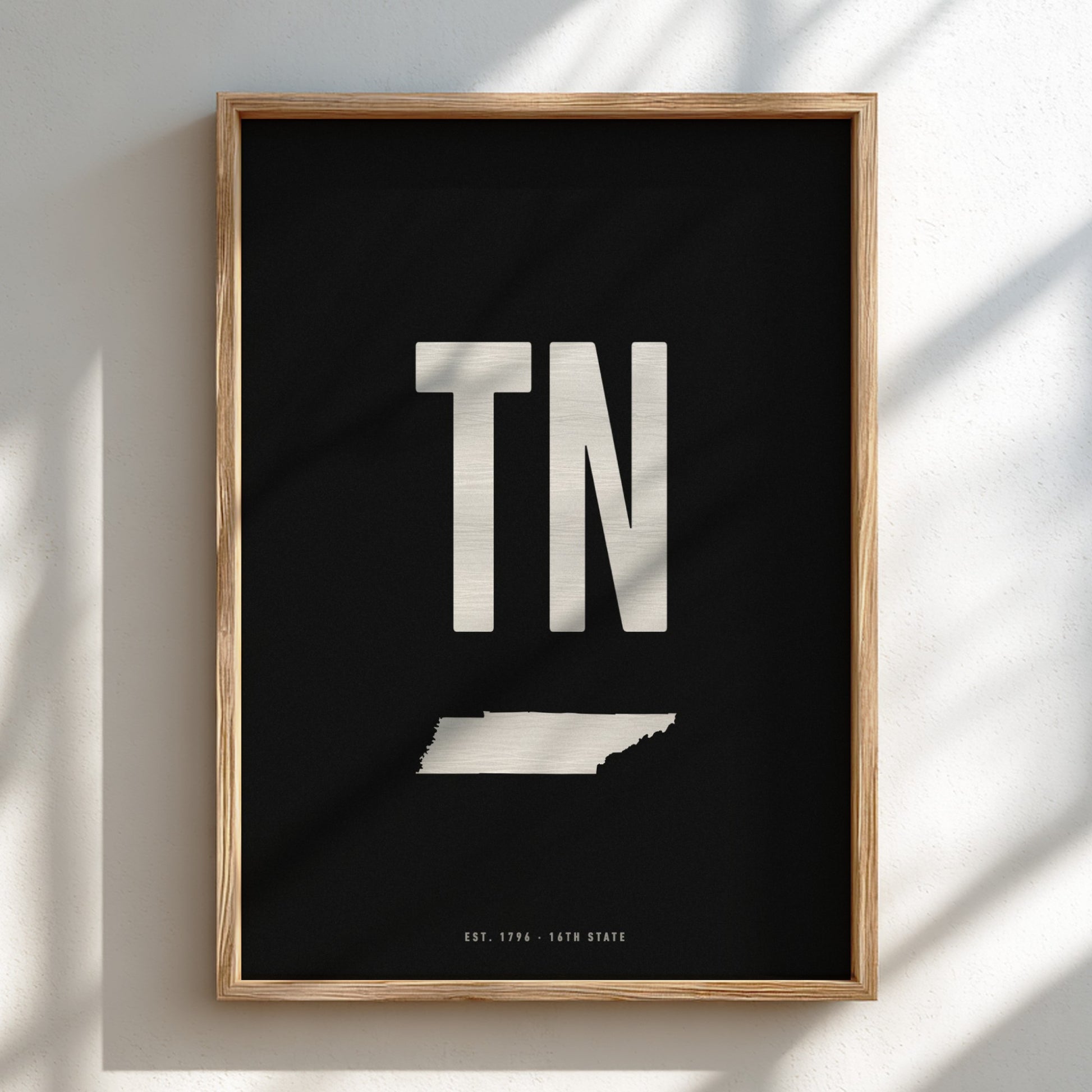 Framed poster with 'TN' and a map of Tennessee on a black background