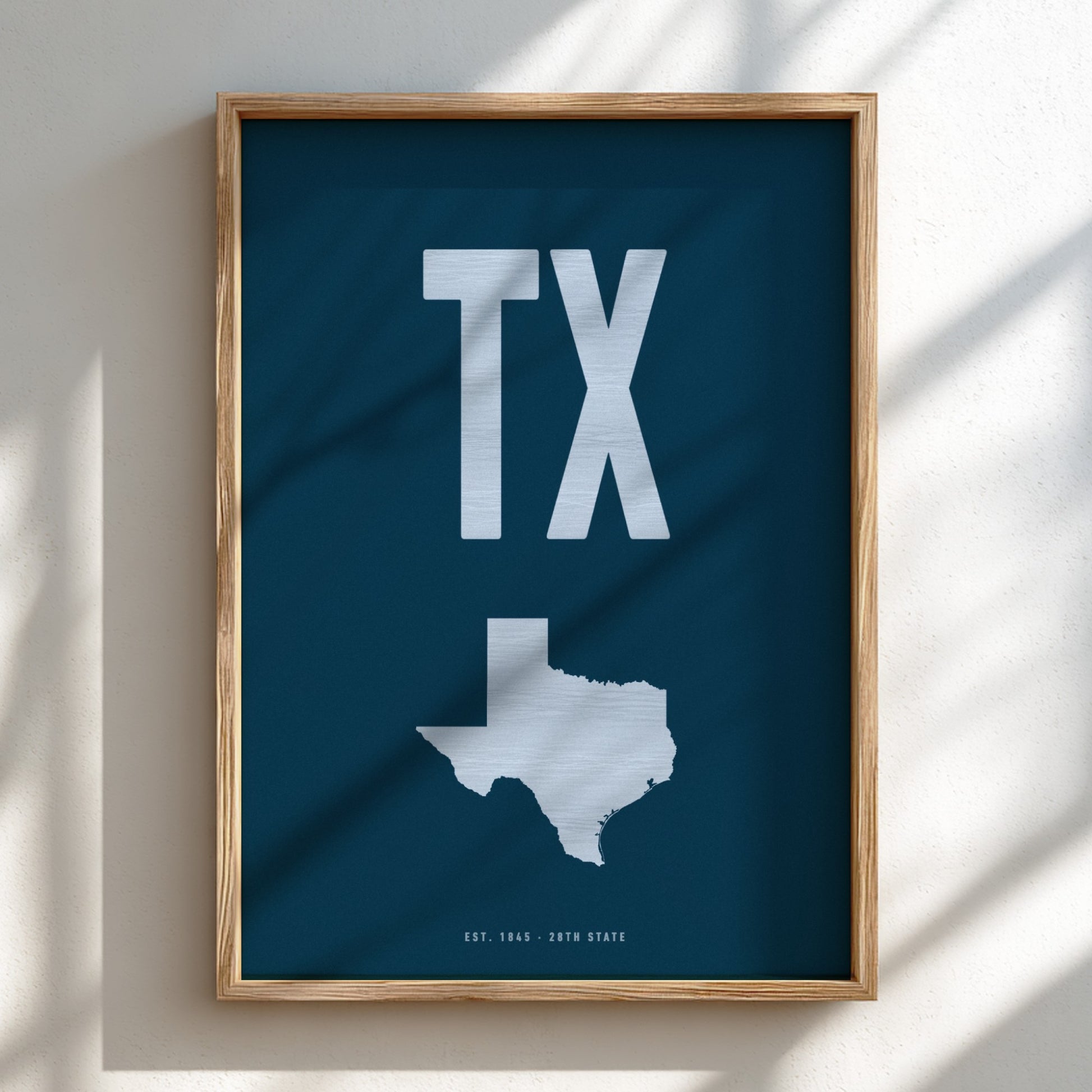 Framed poster with 'TX' and a map of Texas on a blue background