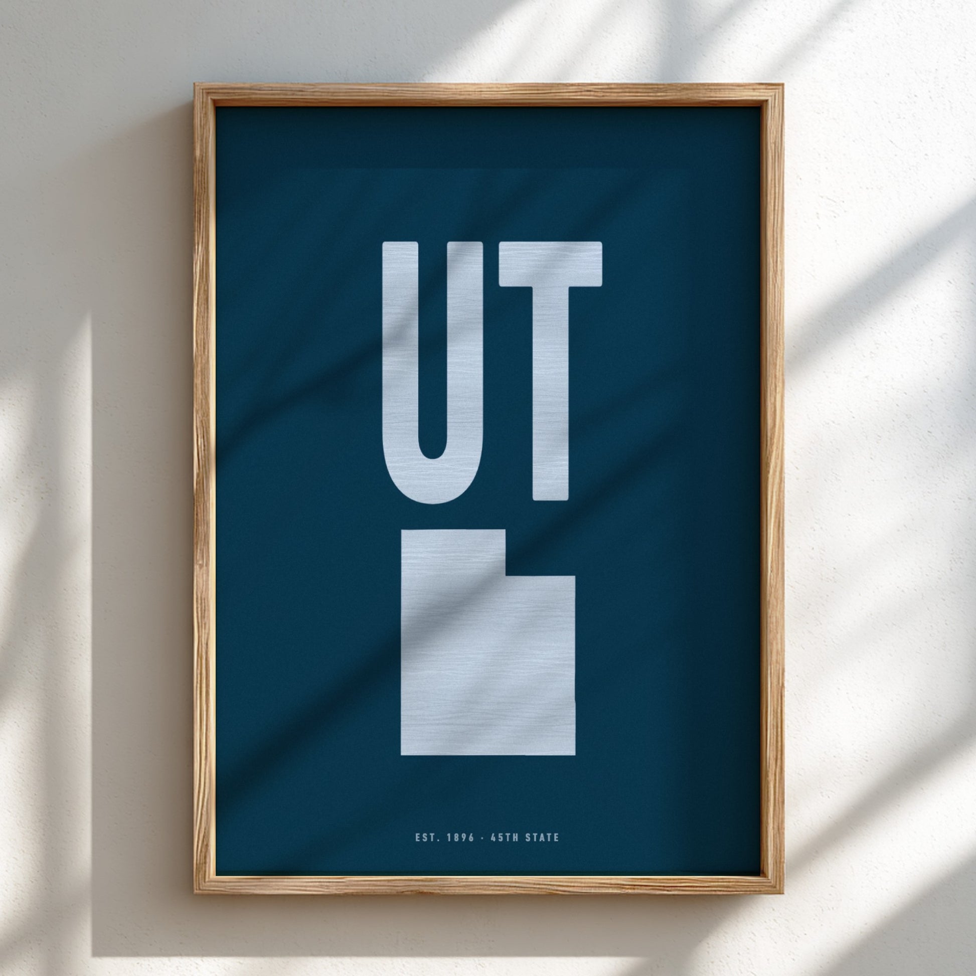 Framed poster with 'UT' on a blue background