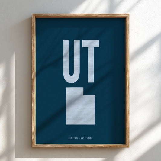 Framed poster with 'UT' on a blue background