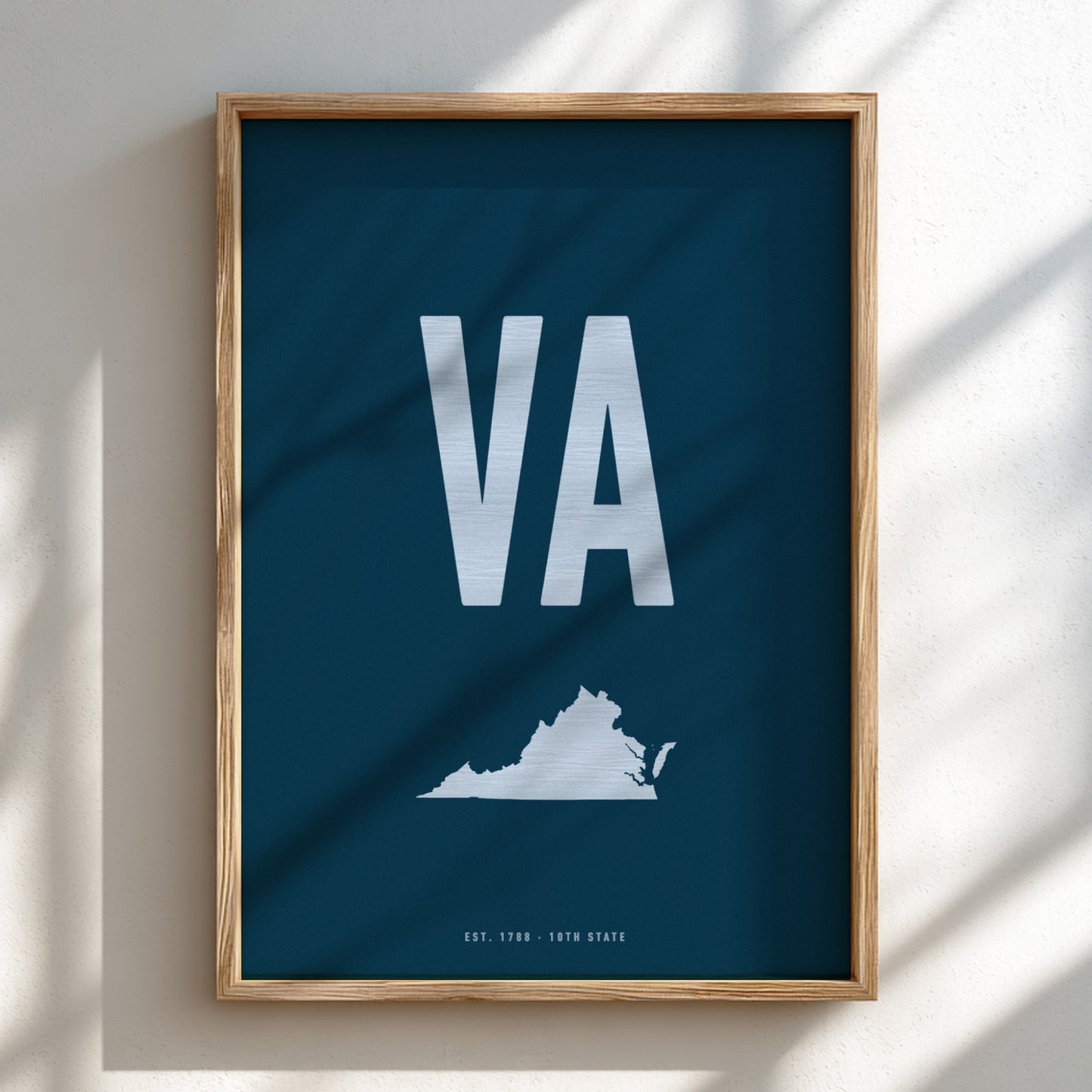 Framed poster with 'VA' and a map of Virginia on a blue background