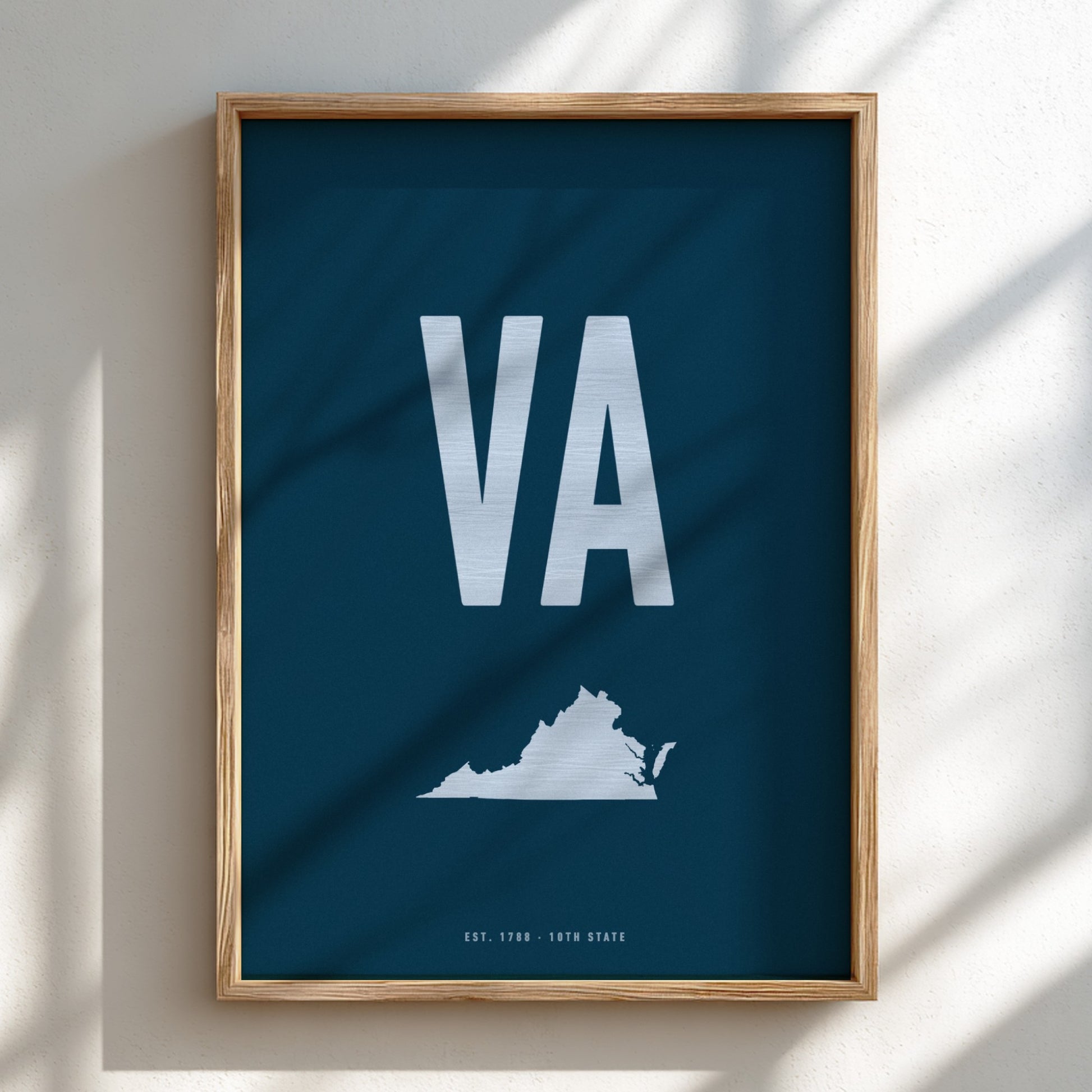 Framed poster with 'VA' and a map of Virginia on a blue background