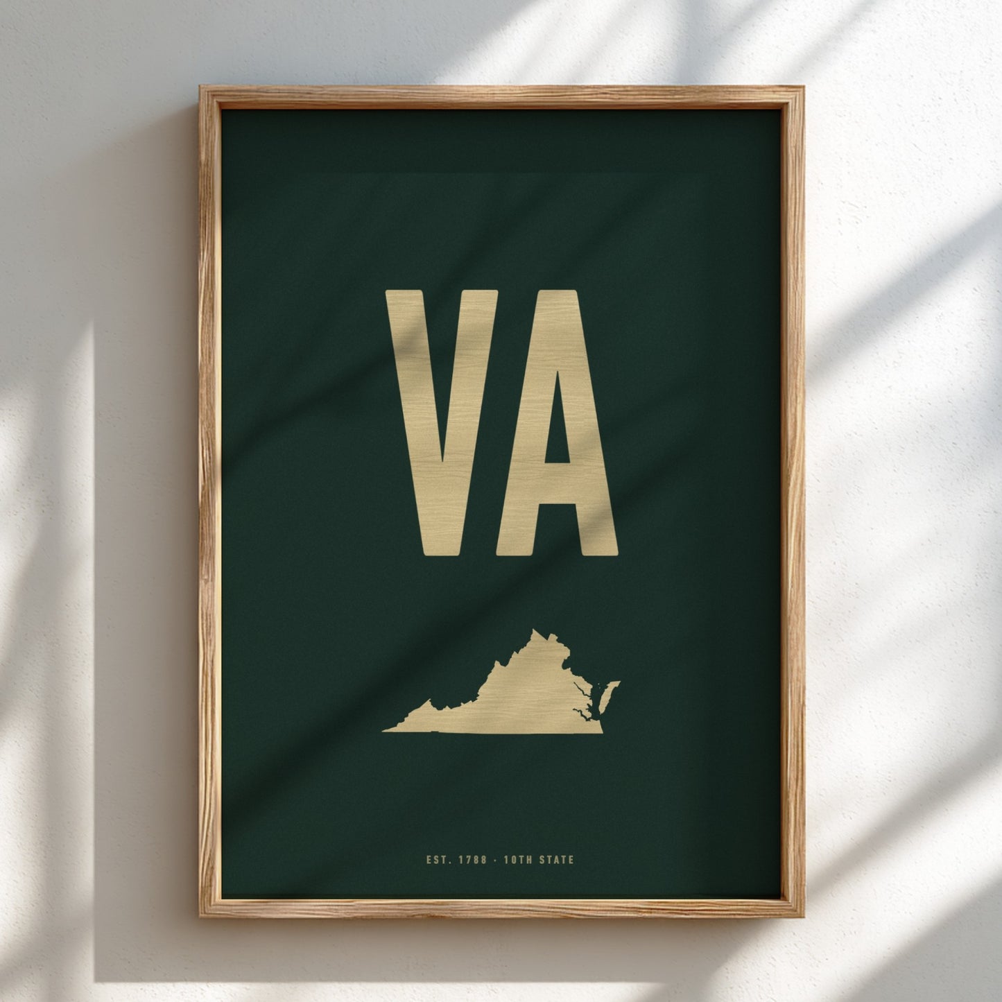 Framed poster with 'VA' initials and a map of Virginia on a dark green background.