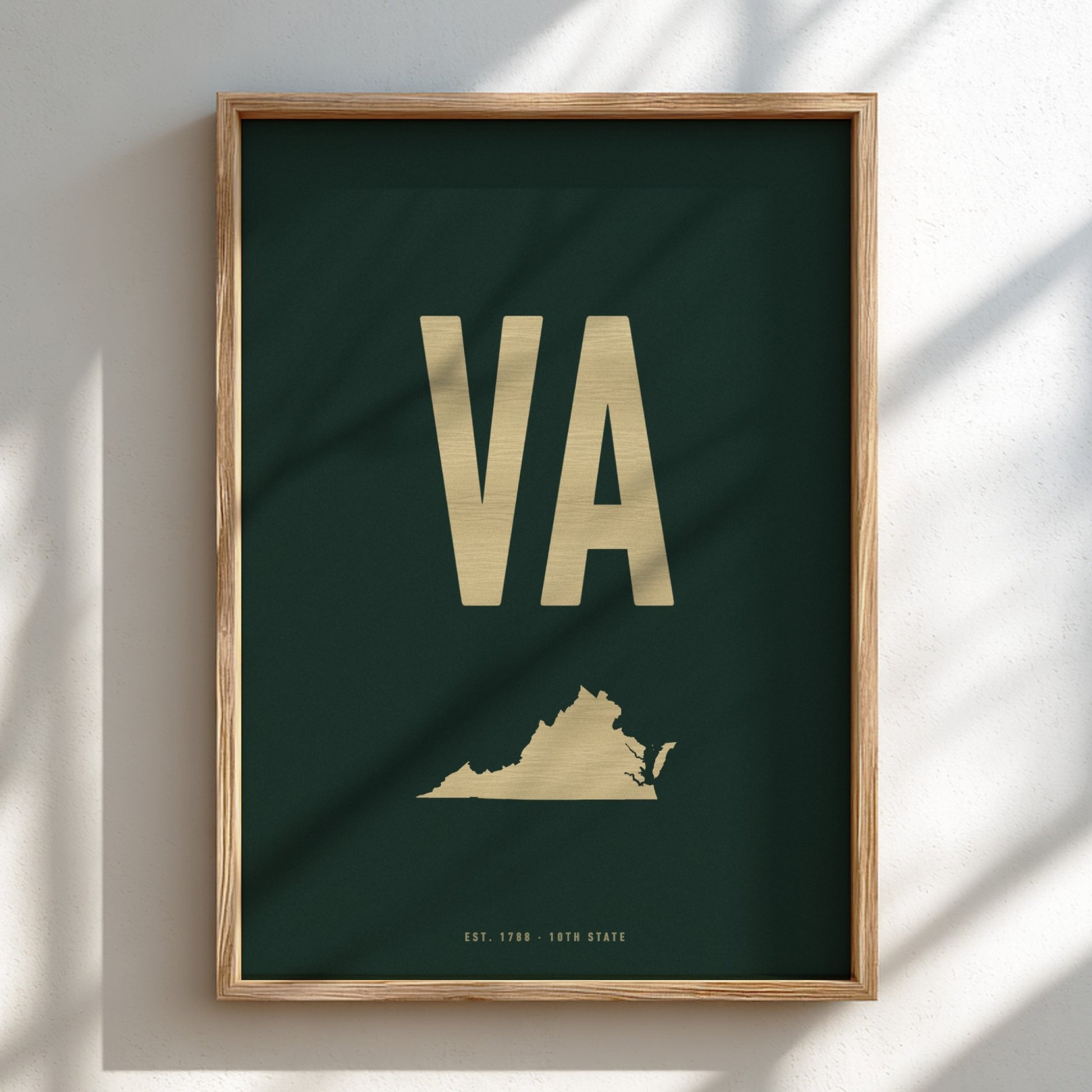 Framed poster with 'VA' initials and a map of Virginia on a dark green background.